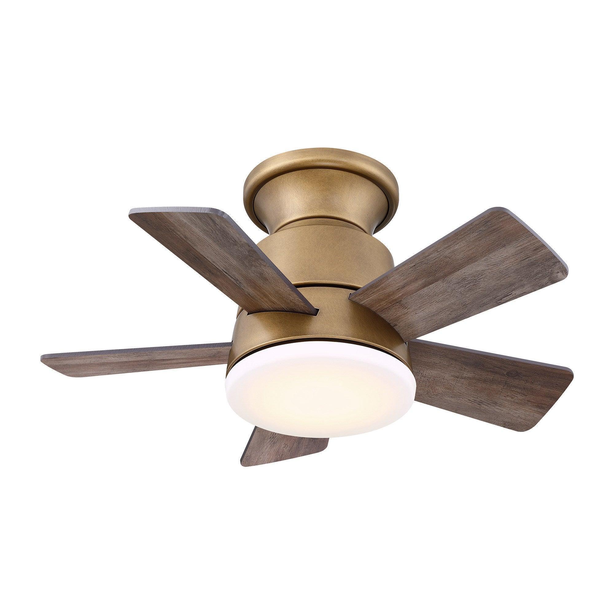 Brushed brass ceiling fan with reversible dark wood-look blades and frosted light
