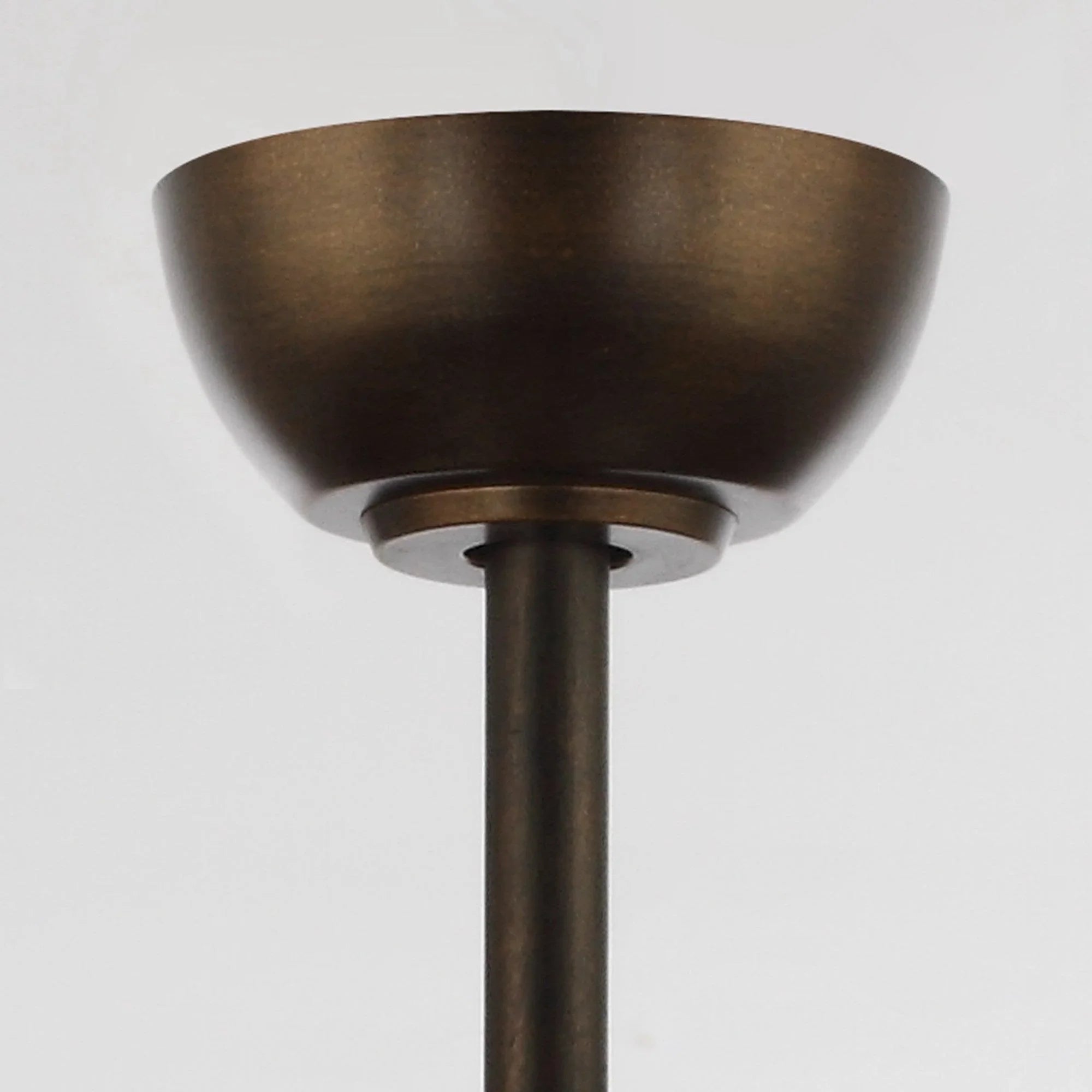 Oil-rubbed bronze ceiling fan canopy and downrod with matte drum housing