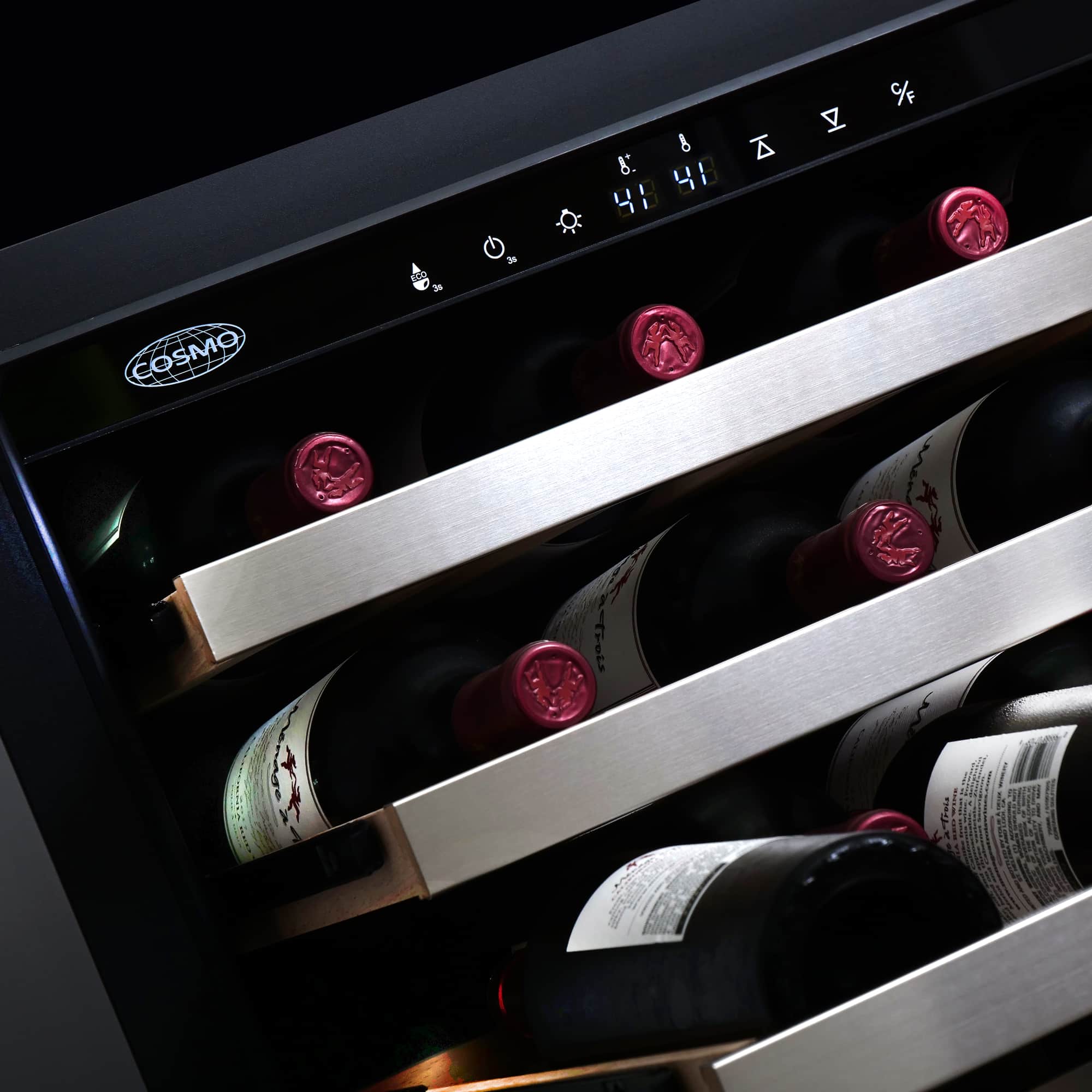 Wine cooler interior close-up with bottles on wood racks and touch control bar