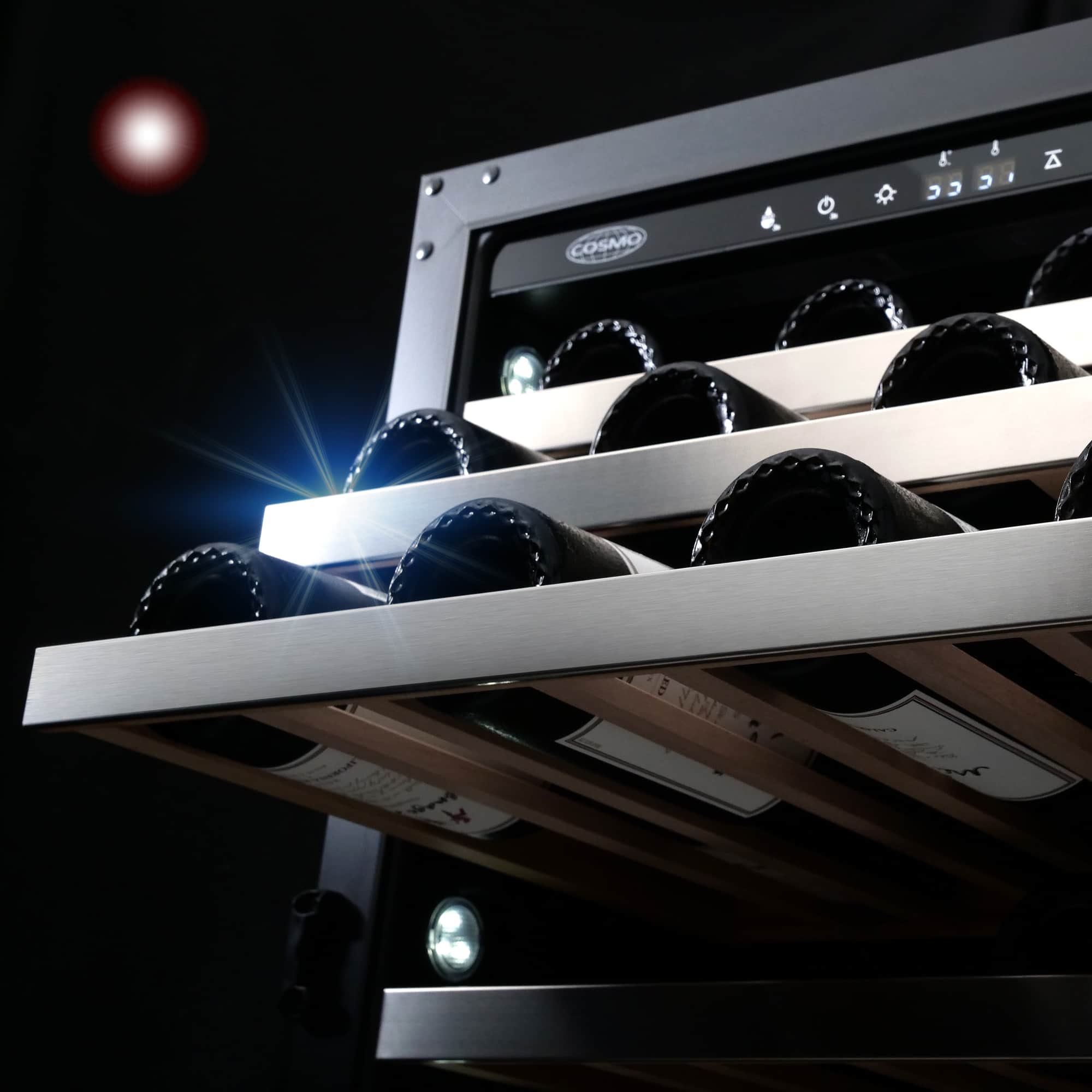 Stainless steel wine cooler door open with bottles on racks and control panel