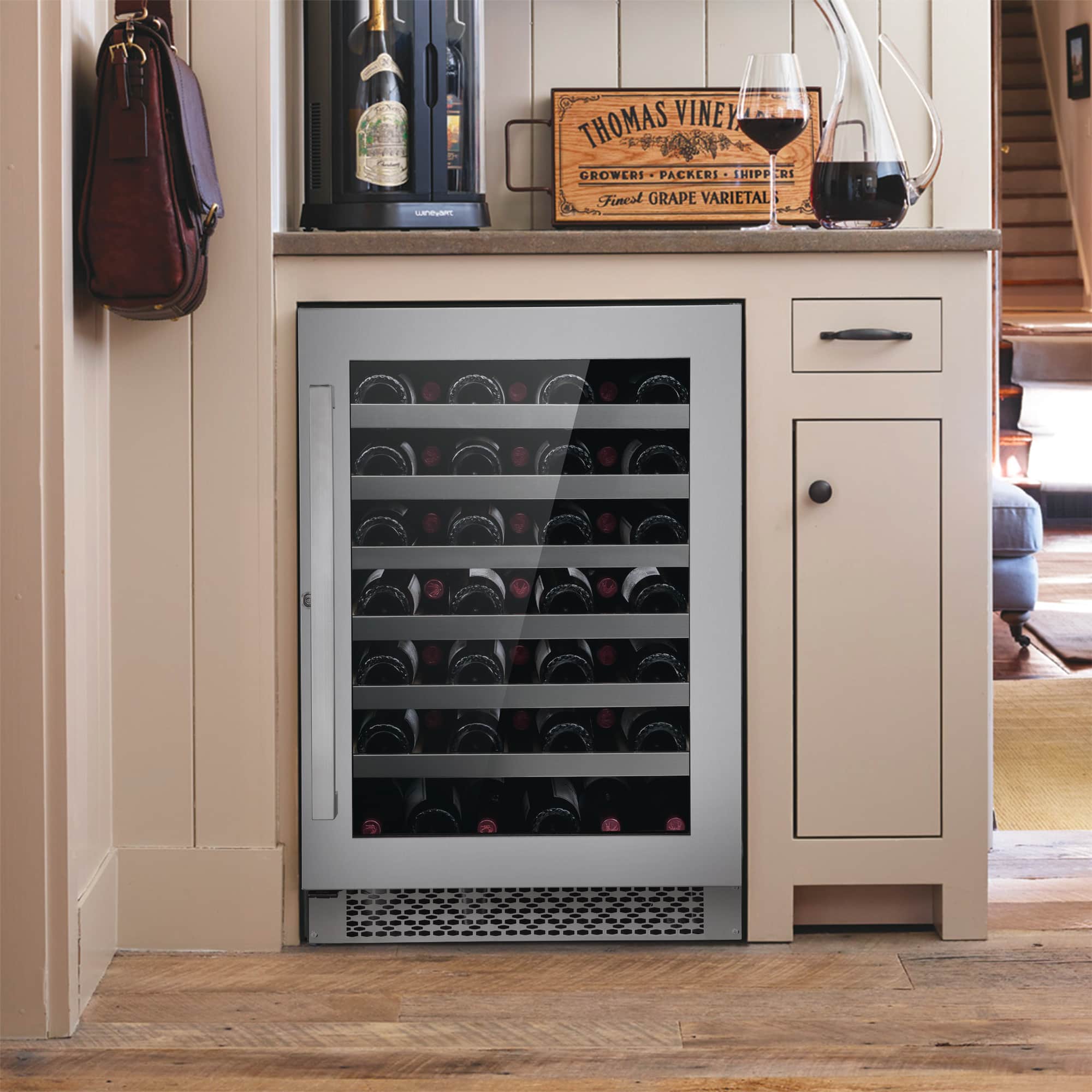 Built-in stainless steel wine cooler with glass door, home kitchen installation