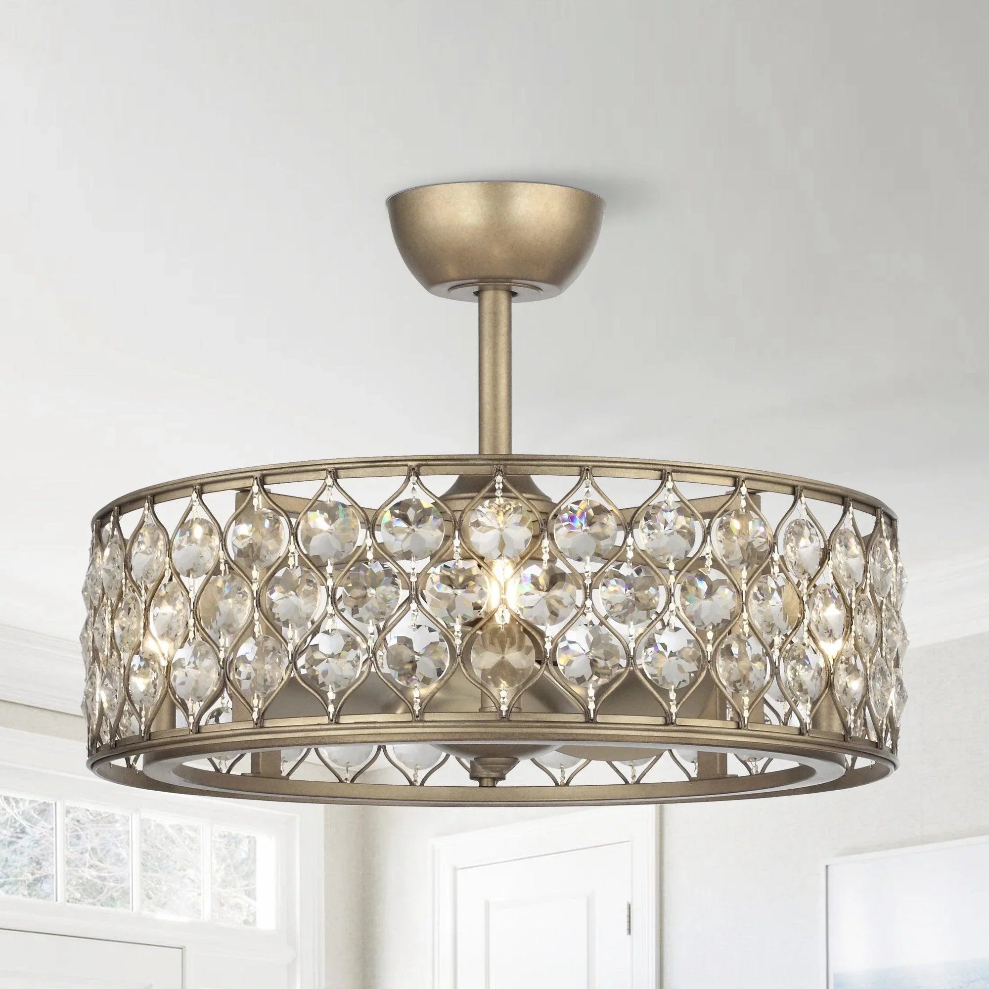 Golden ceiling fan chandelier with crystal-like ring shade and warm bulbs