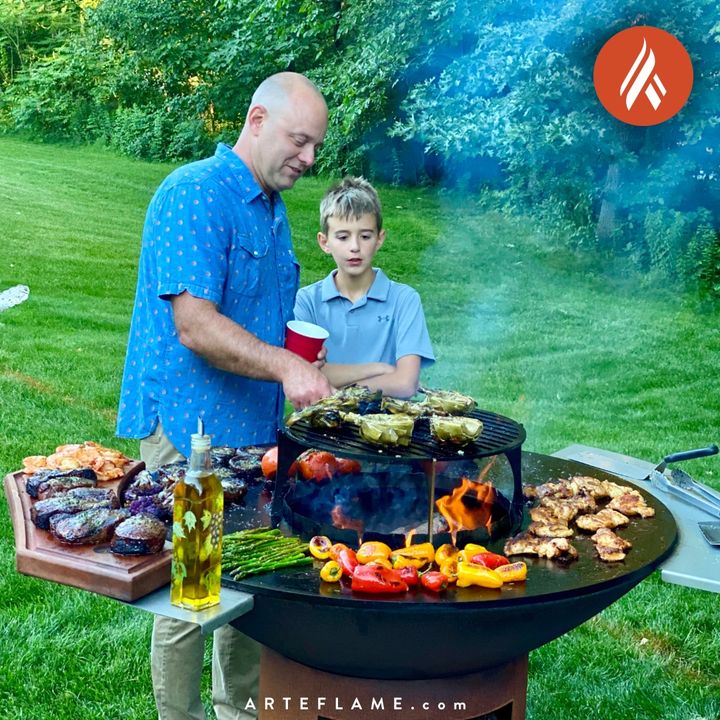 Outdoor grill fire pit with round vented warming table top