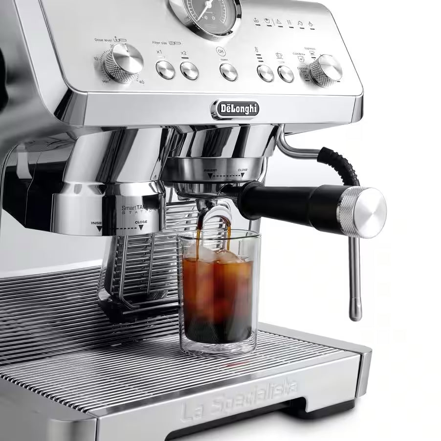Stainless espresso machine showing cold brew cup under portafilter and steam wand