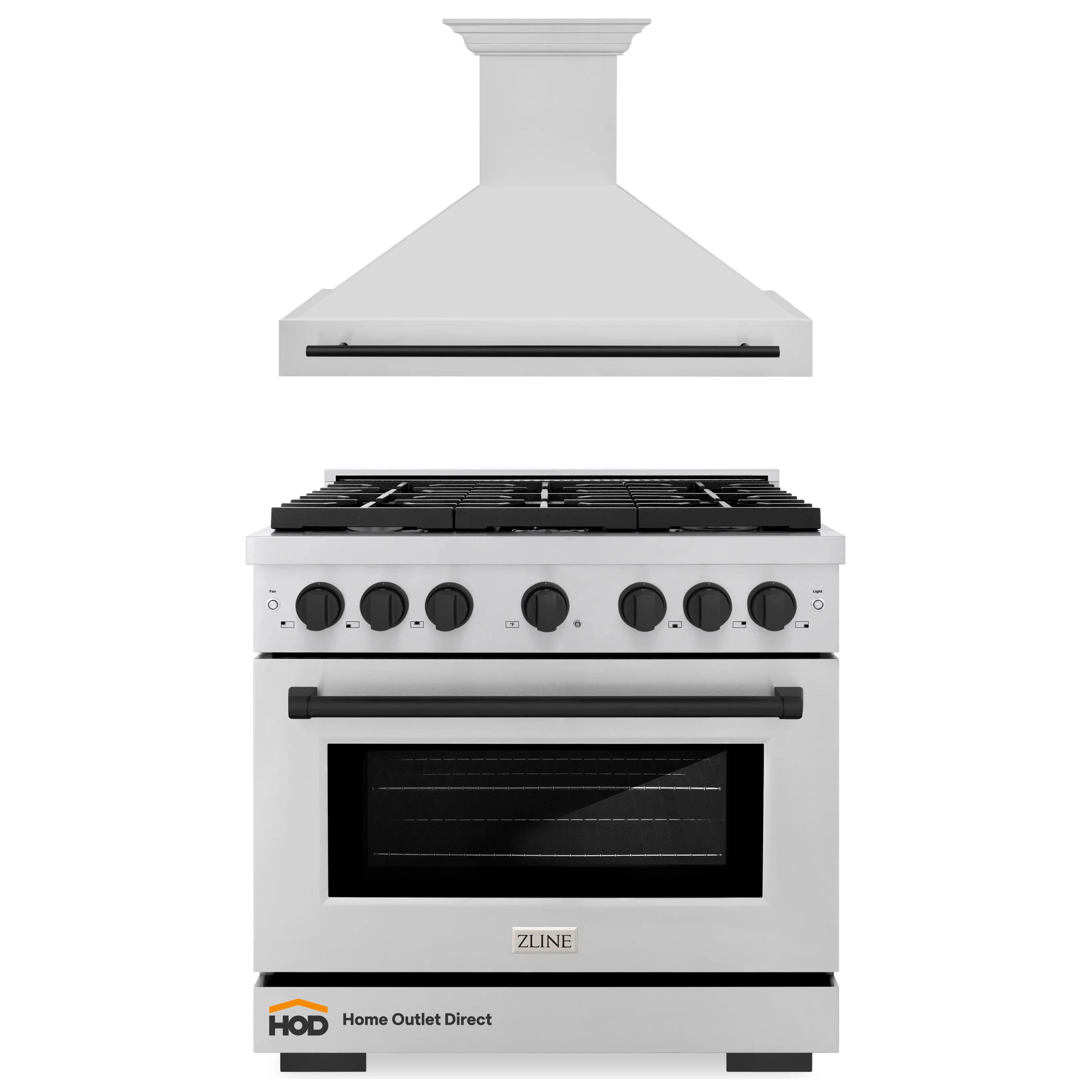Stainless gas range with black grates and wall-mounted range hood