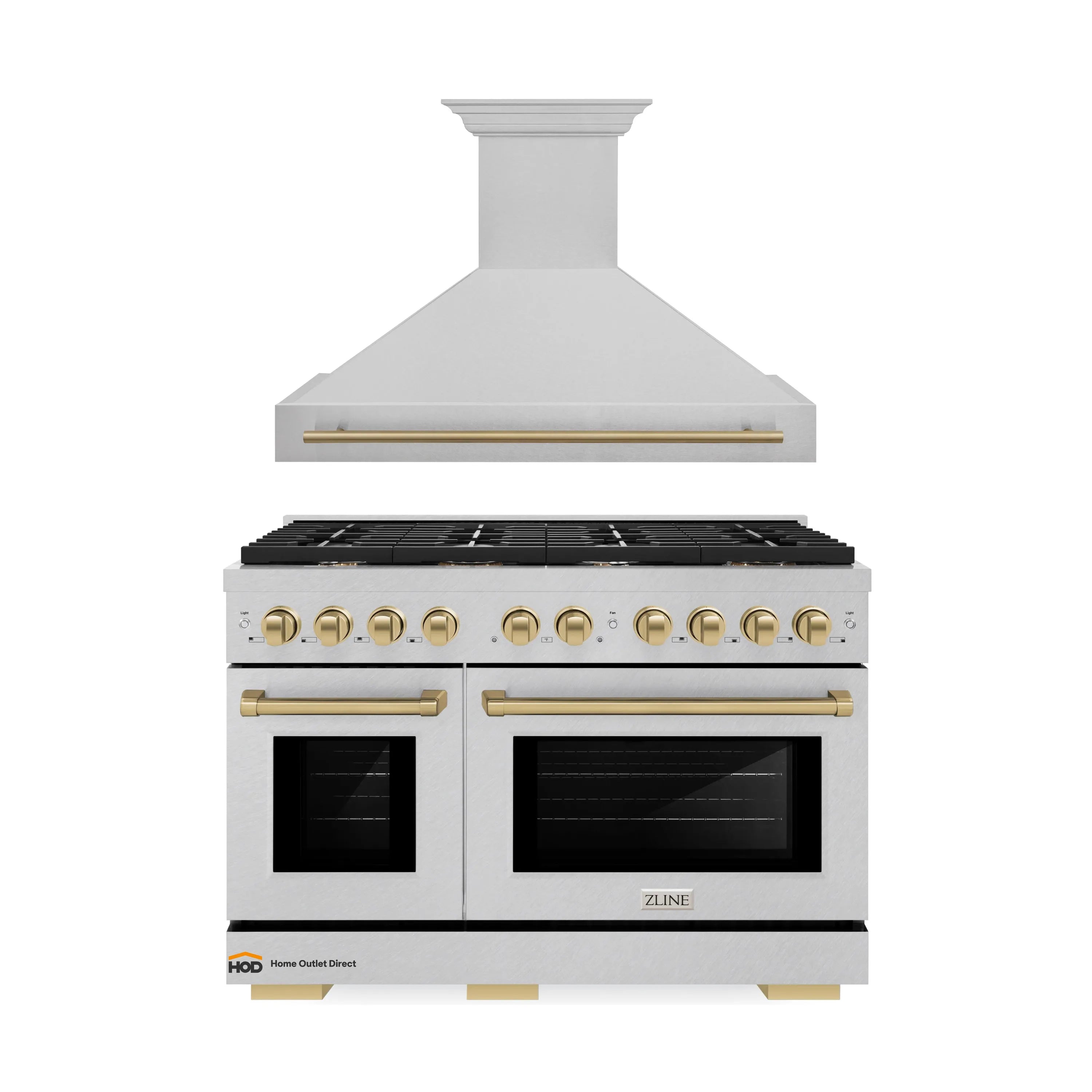 Wall hood and satin stainless gas range with champagne bronze handles and control knobs