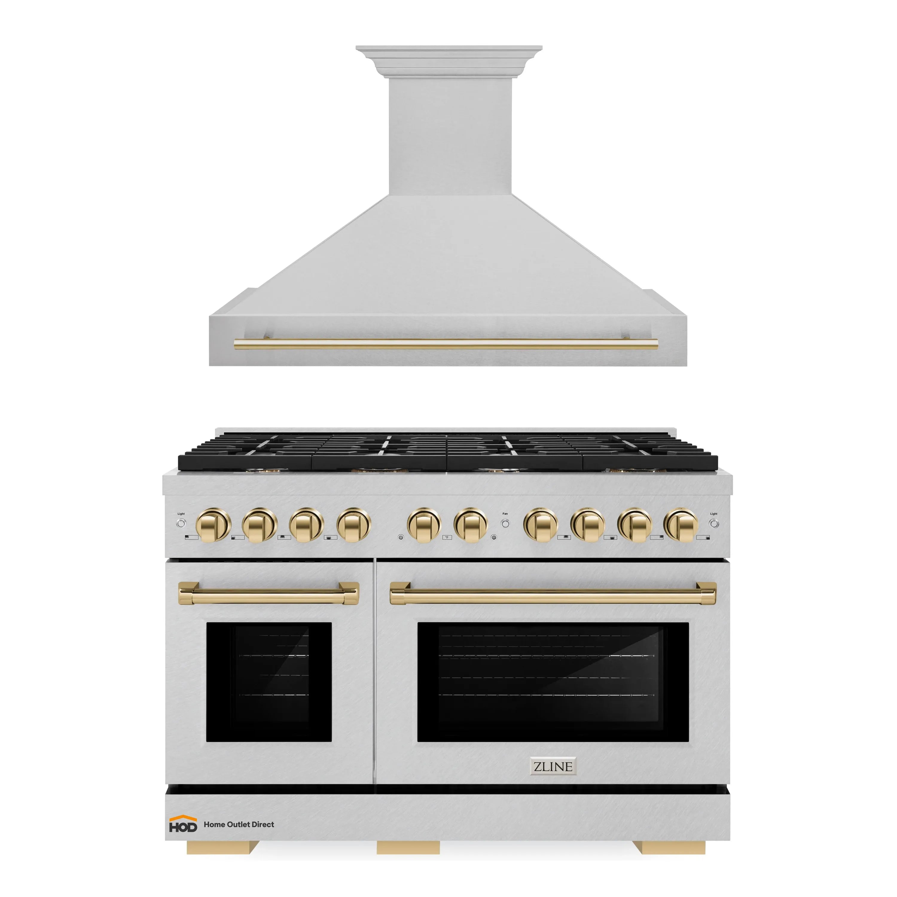 Satin stainless gas range and wall hood with gold trim, black grates and controls