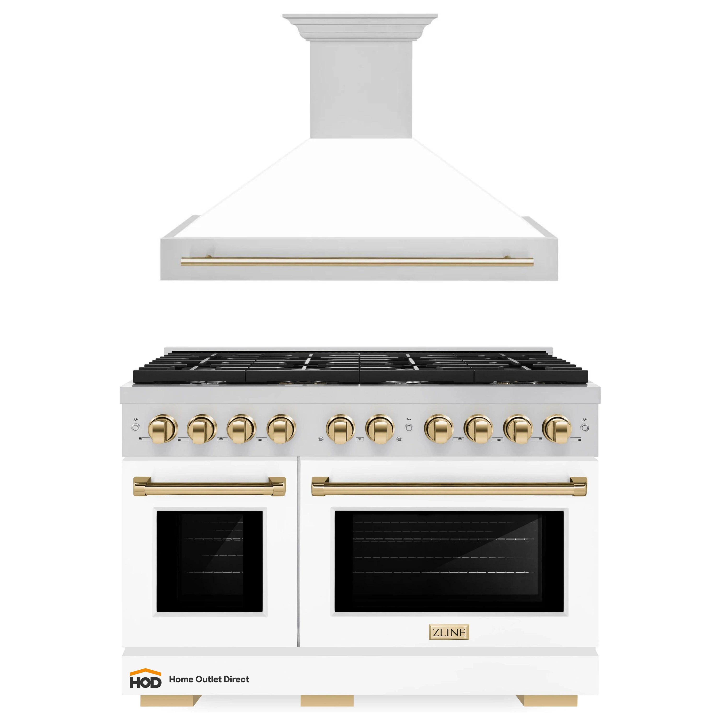White gas range with stainless trim and gold knobs, paired with wall-mounted range hood.