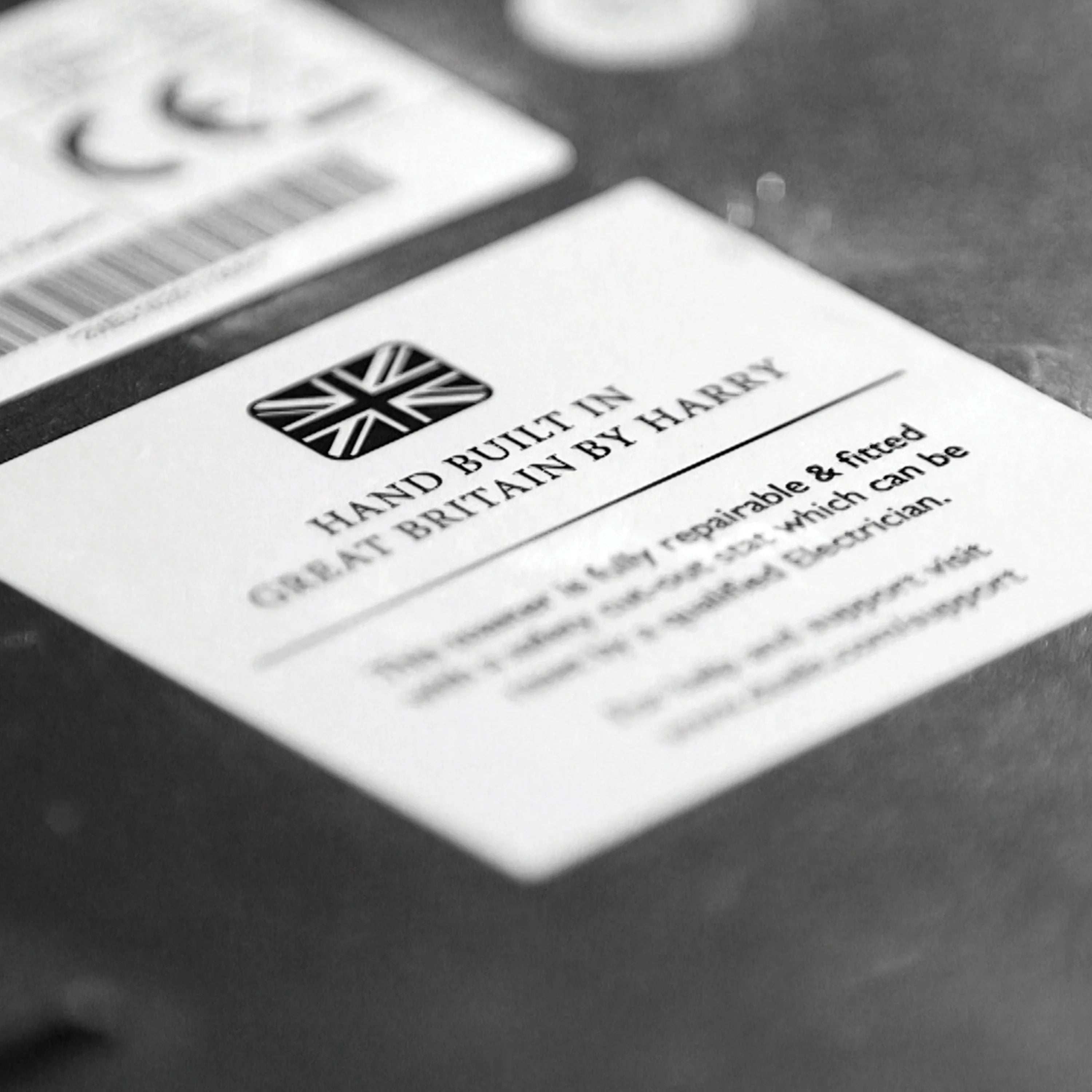 Printed packaging card with "Hand Built" and "Guaranteed Britain" text