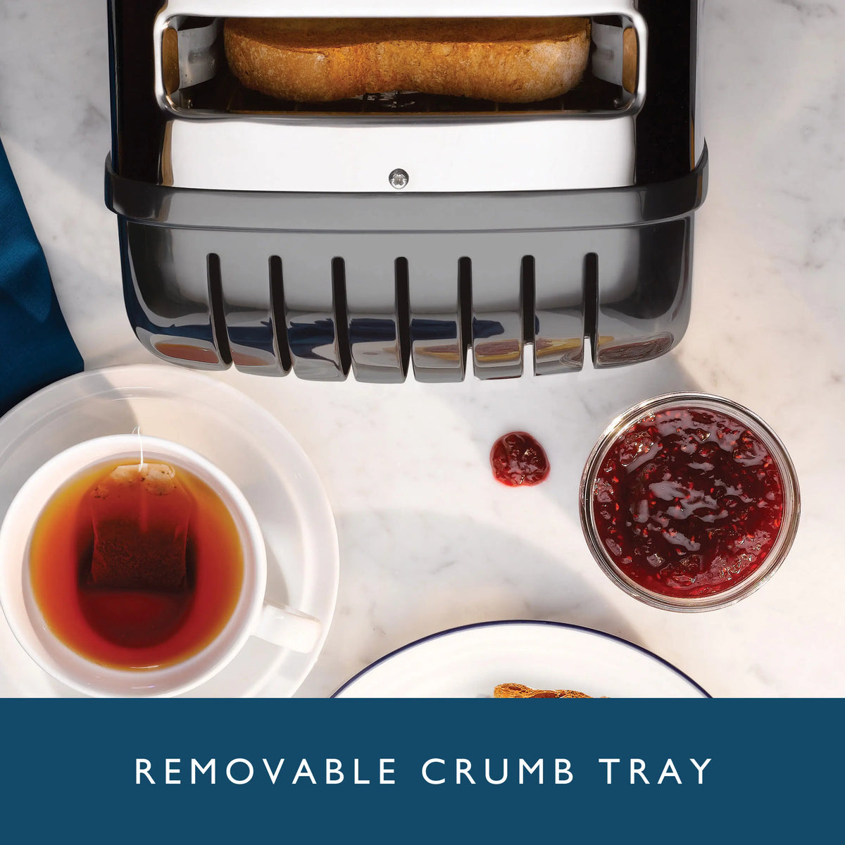 Dualit 2-slice toaster with removable crumb tray and two toasted bread slices