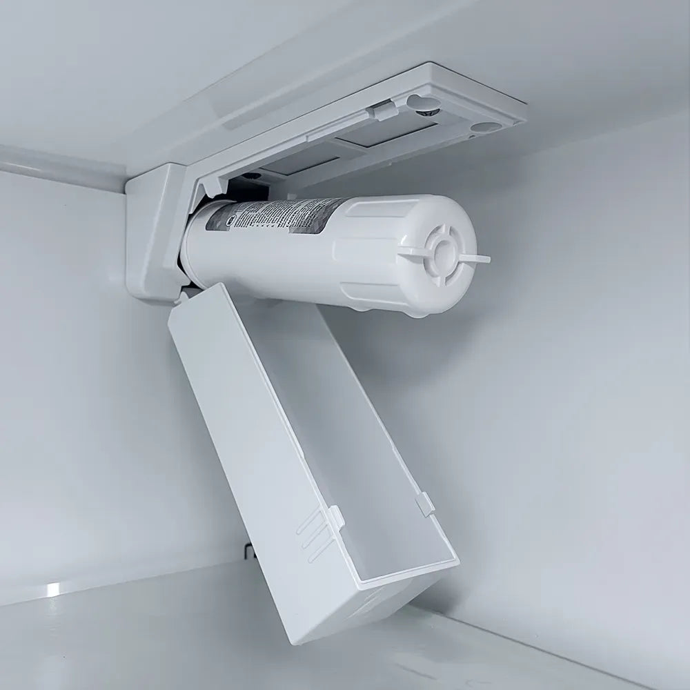 Refrigerator ice dispenser chute with water feed and white ice bin liner
