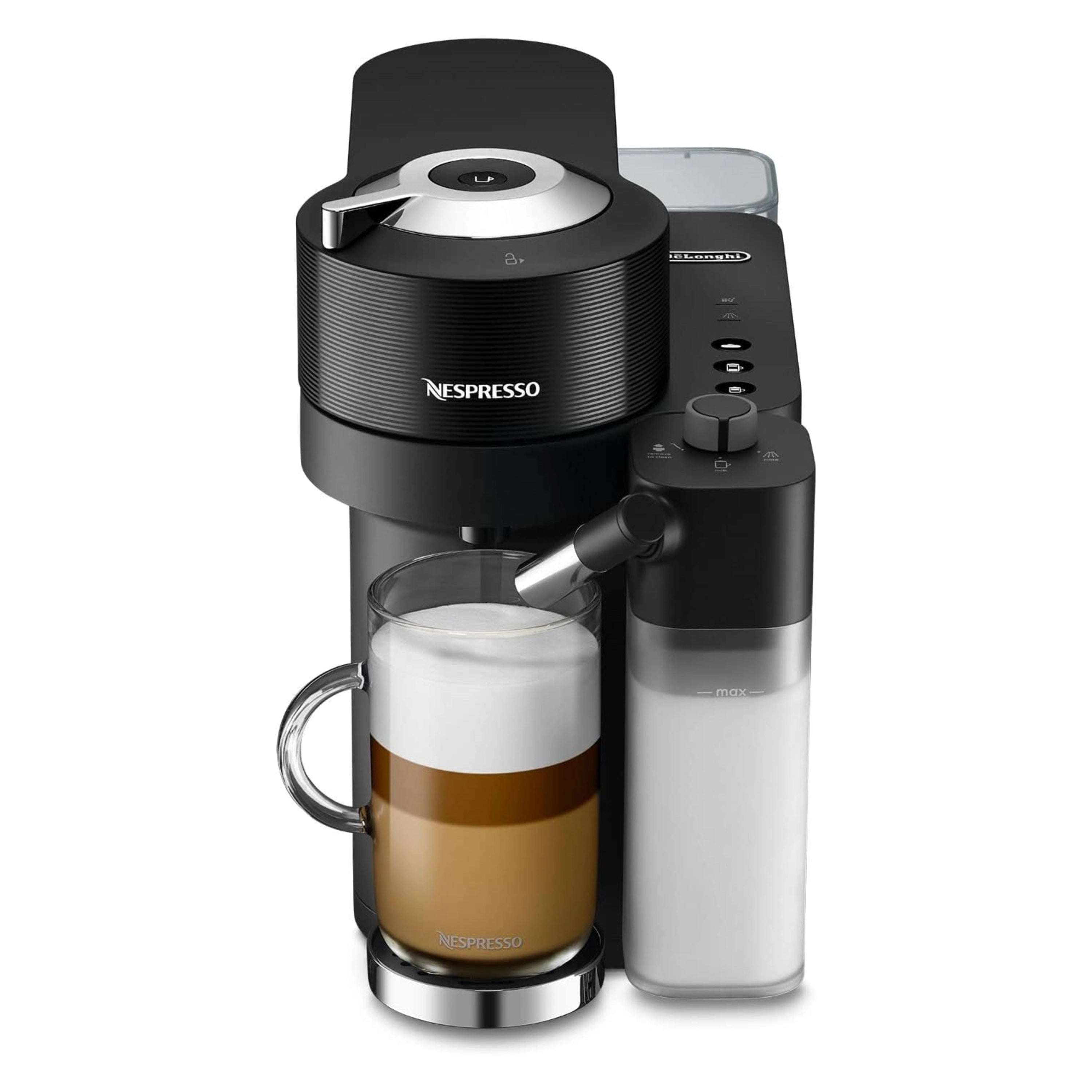 Black Nespresso coffee machine with mug and milk container