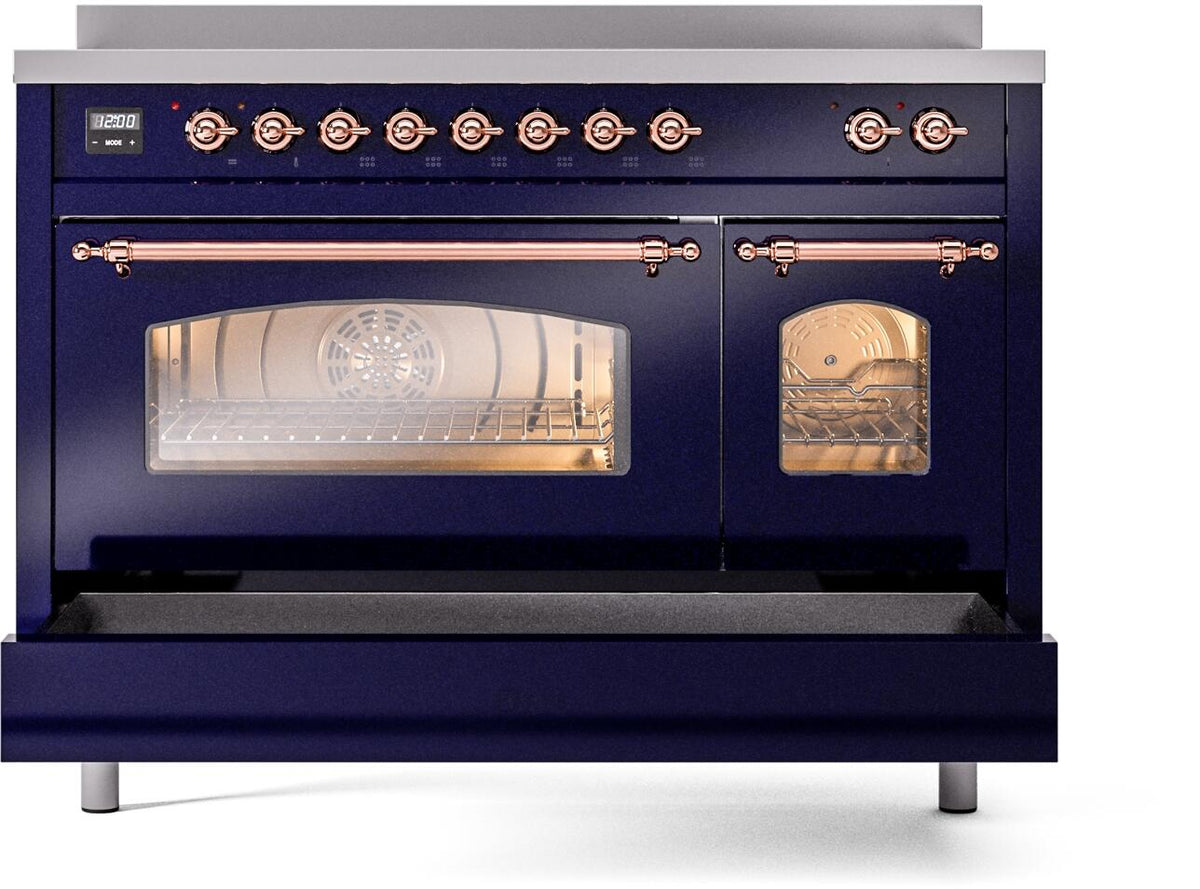 Midnight blue freestanding induction range with copper bar handles and glass oven door