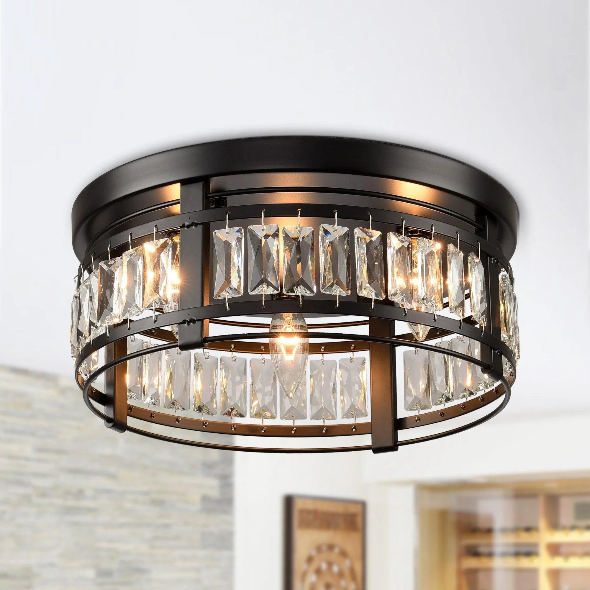Black 3-light flush mount ceiling light with clear crystal prisms and exposed bulbs