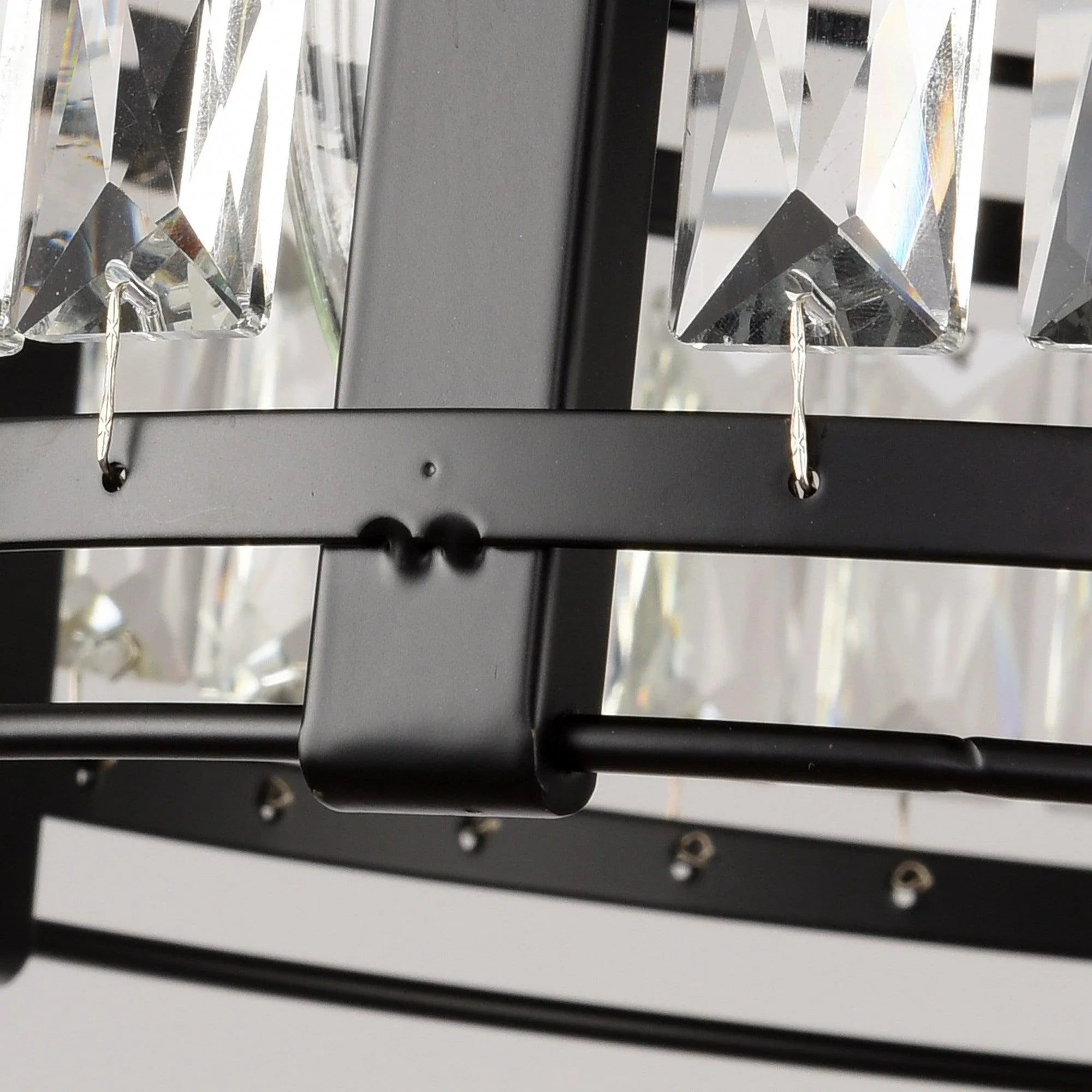 Close-up of black support bars holding clear crystal prism pieces