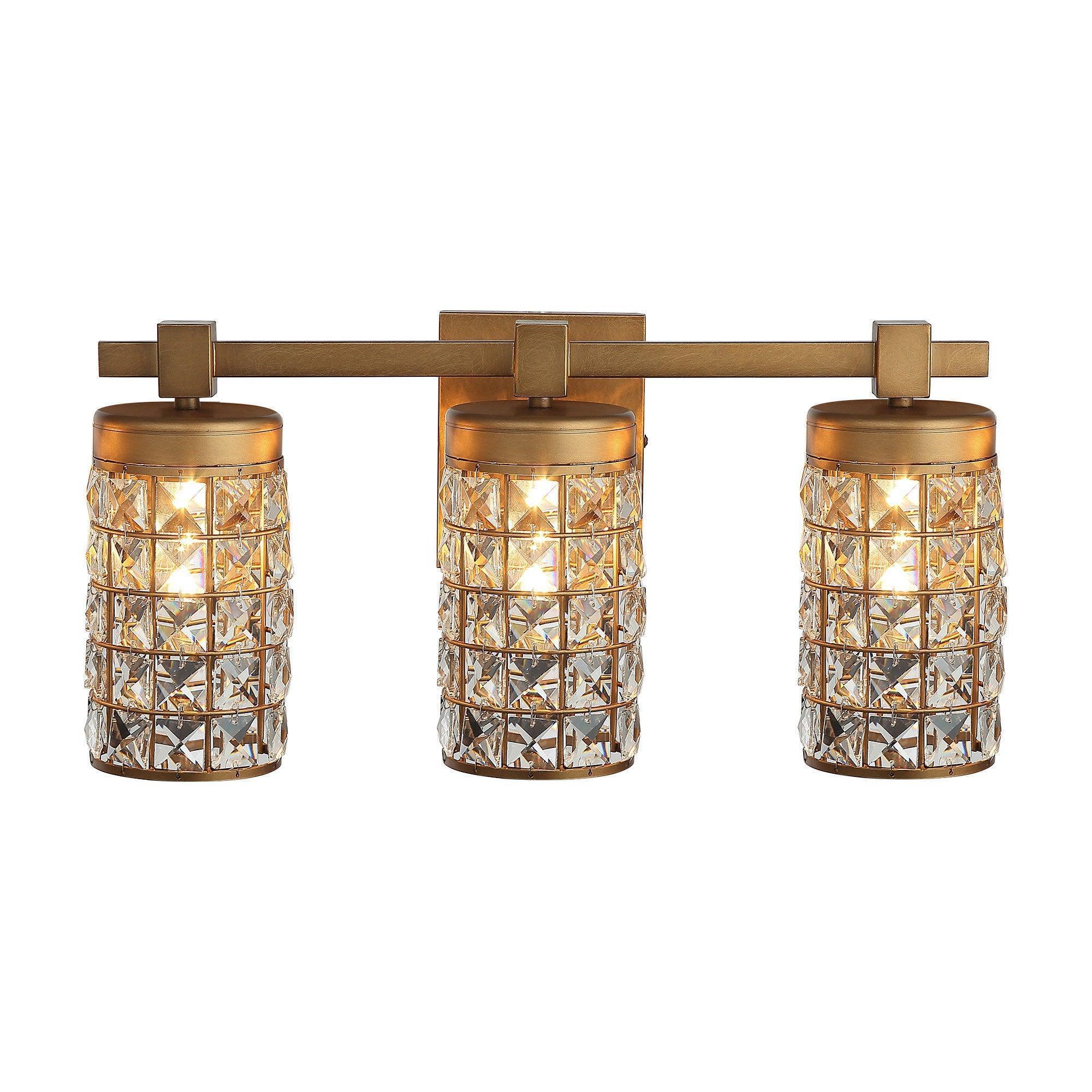 Golden 3-light vanity wall sconce with three cylindrical crystal glass shades and linear bar