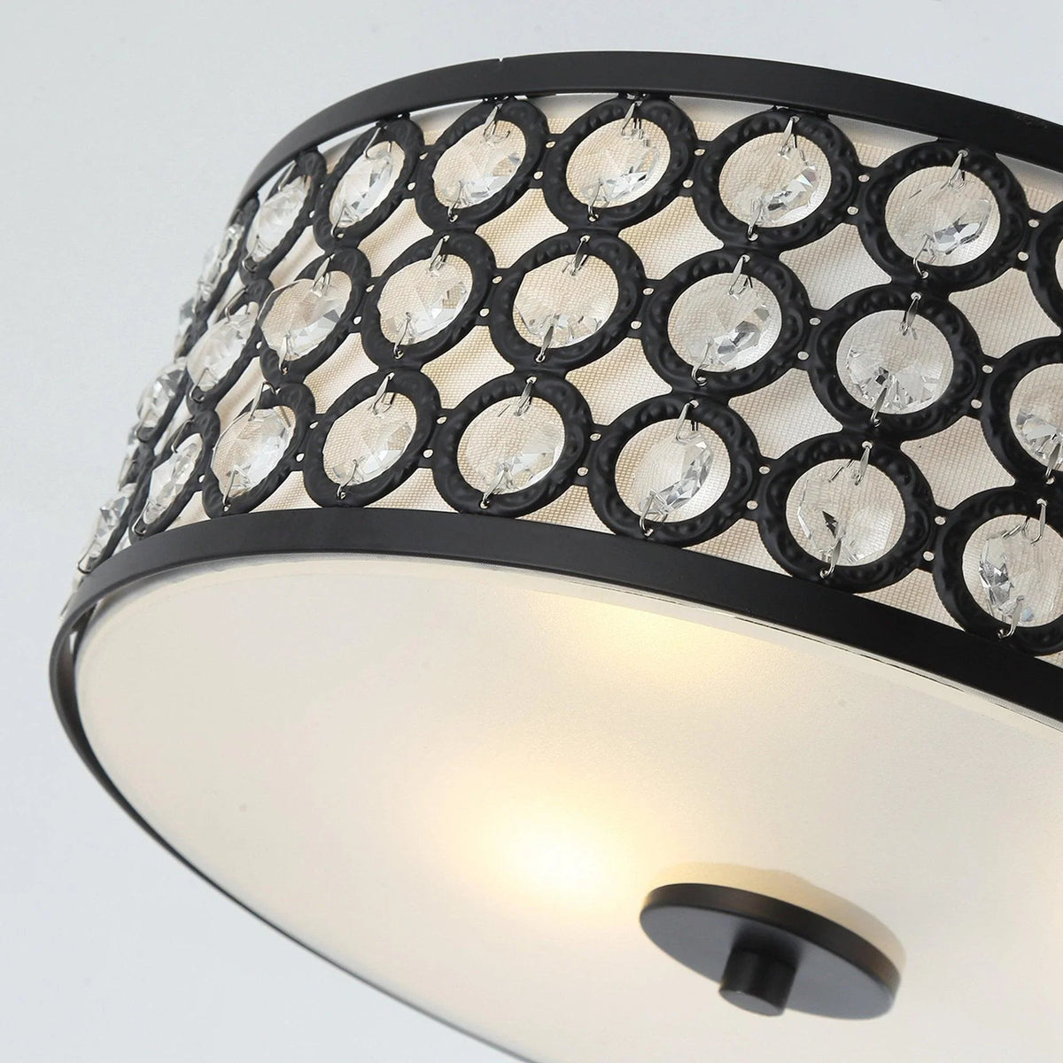 Black flush mount ceiling light close-up, crystal ring border and frosted glass diffuser