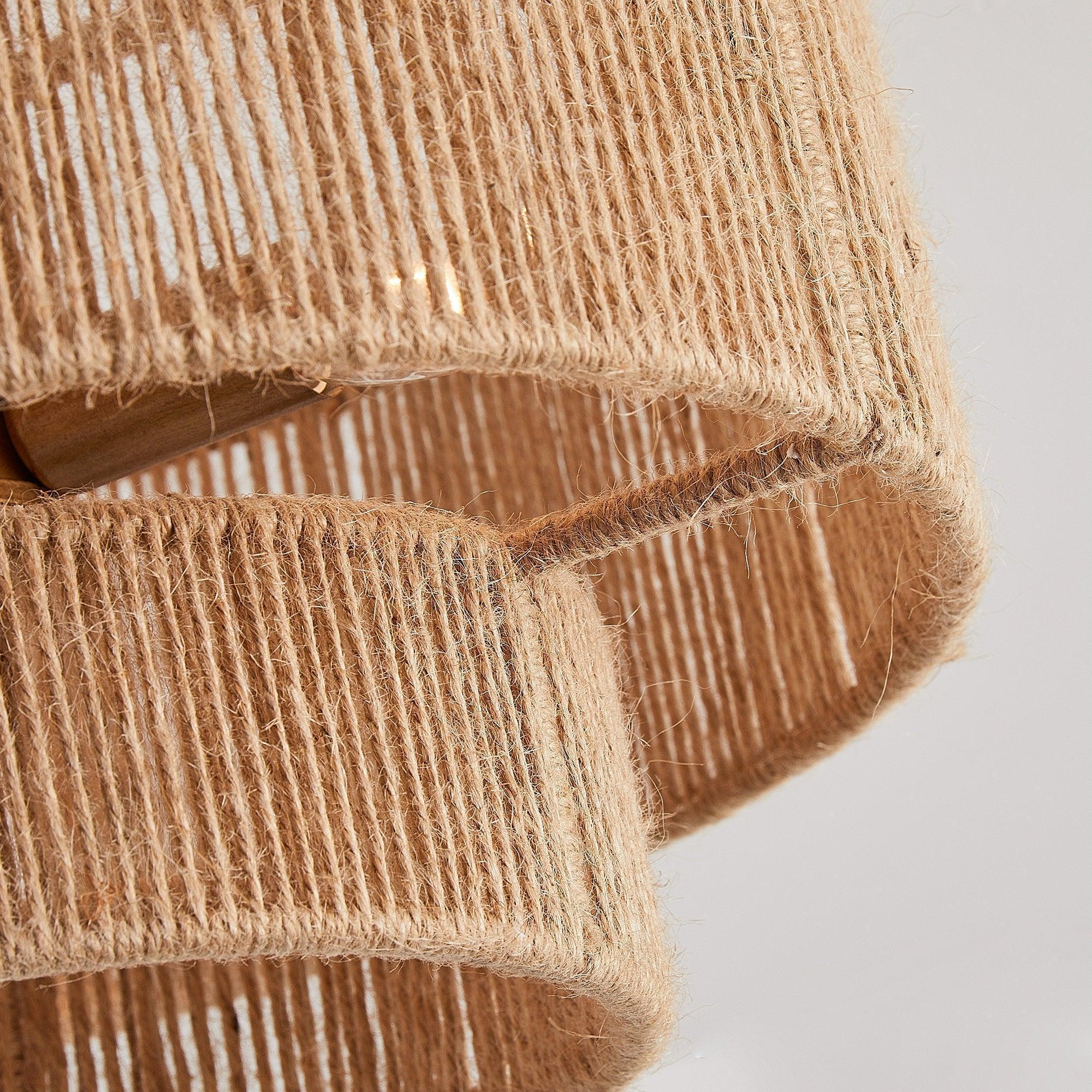 Close-up of golden woven fabric drum shade with textured vertical threads.