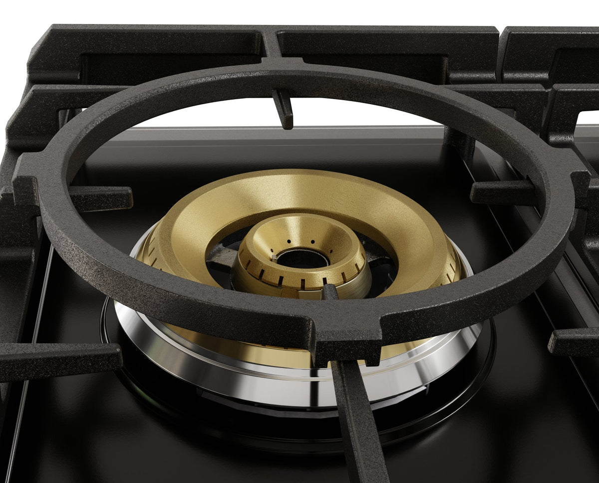 Tri-ring burner head detail with brass-style inner cap on a black gas cooktop grate.