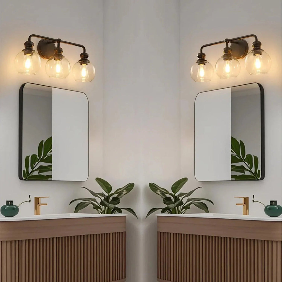 Two black 3-light vanity lights with clear glass globe shades above dual mirrors
