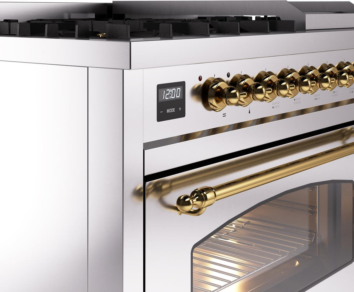 Stainless steel dual fuel freestanding range with brass control knobs and oven window