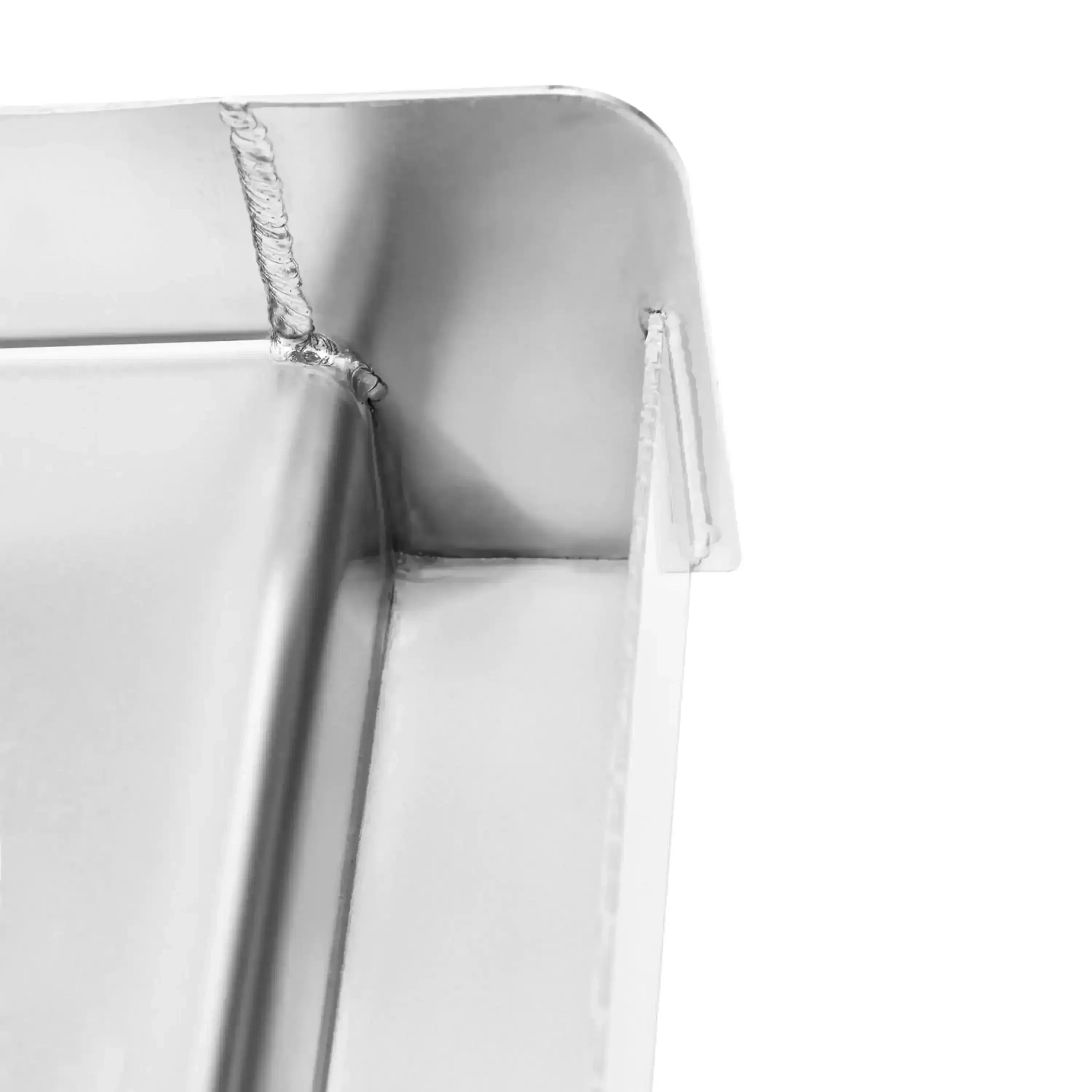 Stainless steel griddle plate corner detail with folded rim and side seam