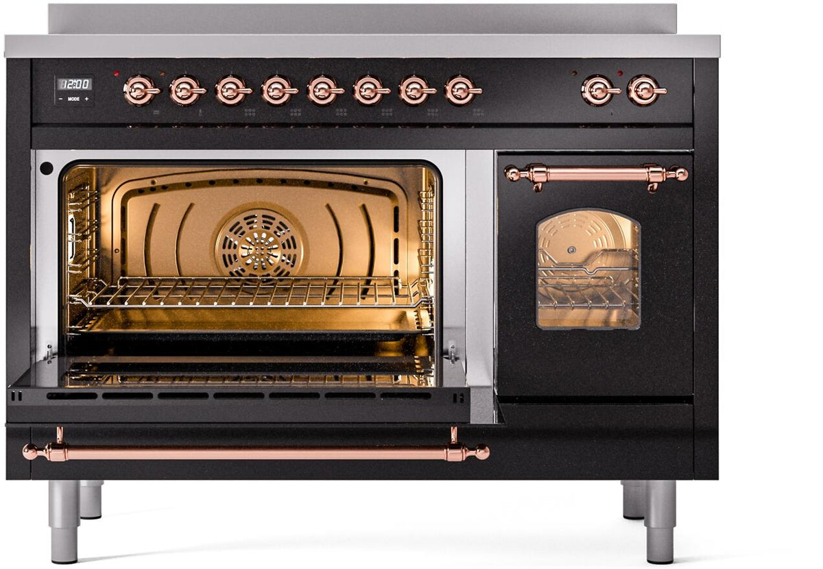 Freestanding induction range with left oven open, right oven viewing window, copper-trim accents
