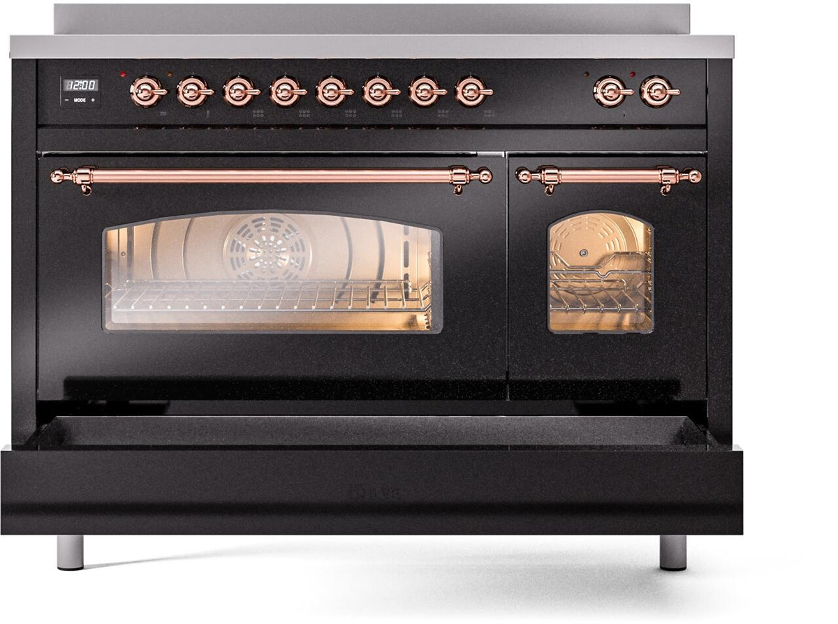 Freestanding induction range with oven door open, glossy black front panel, copper handle trim