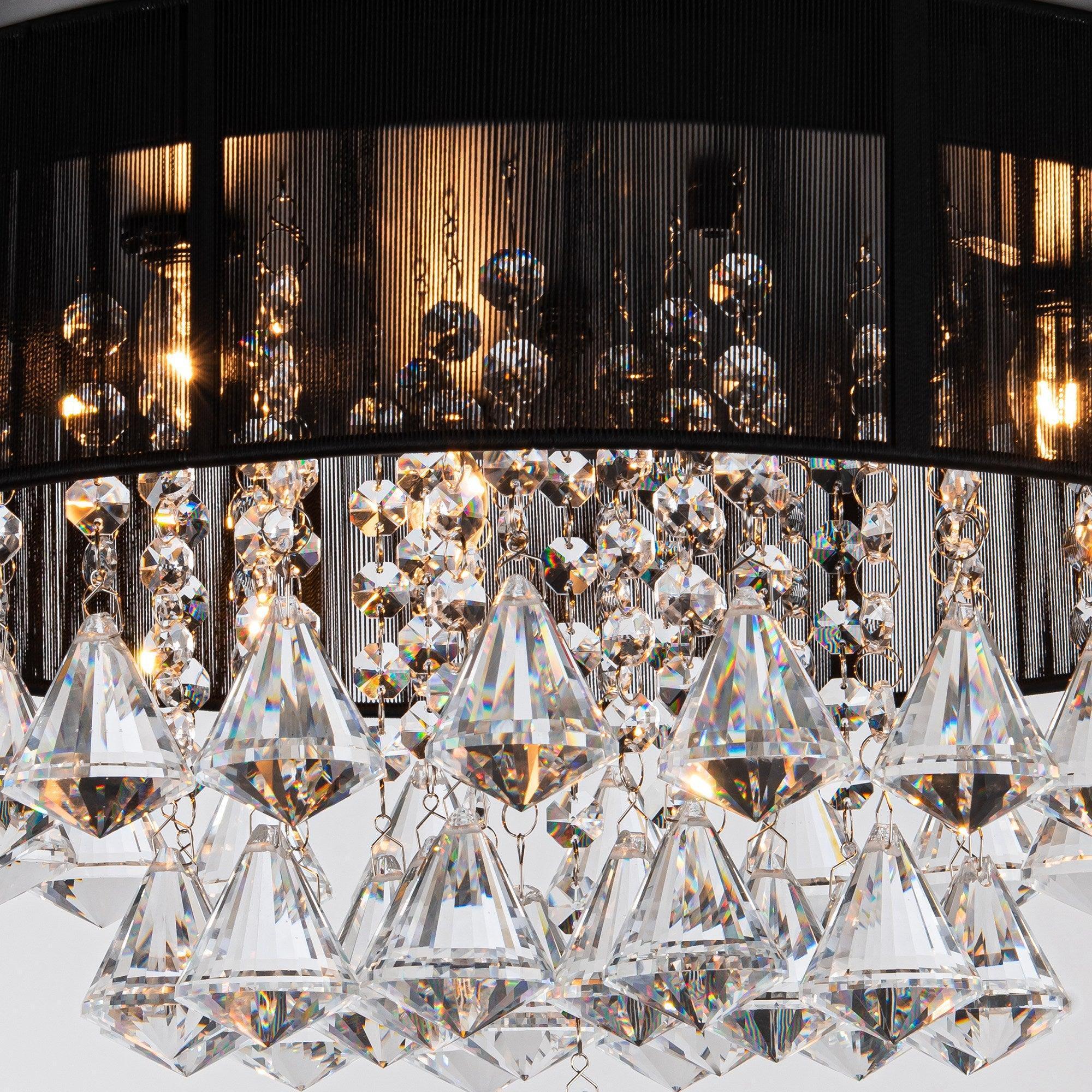 Crystal ceiling fan light fixture with hanging faceted prisms and metal rings