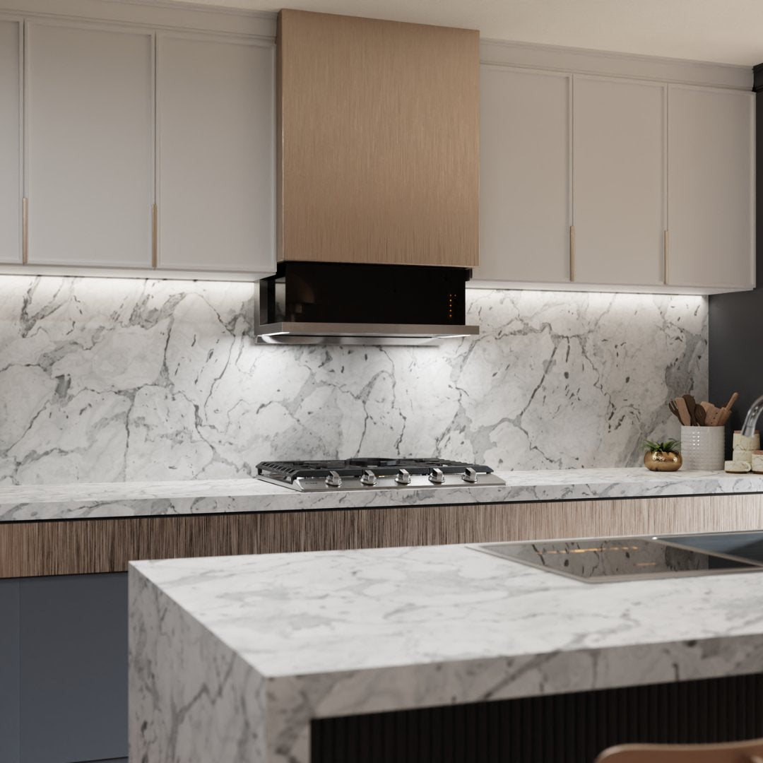 Black under-cabinet insert range hood above a cooktop beneath light cabinets