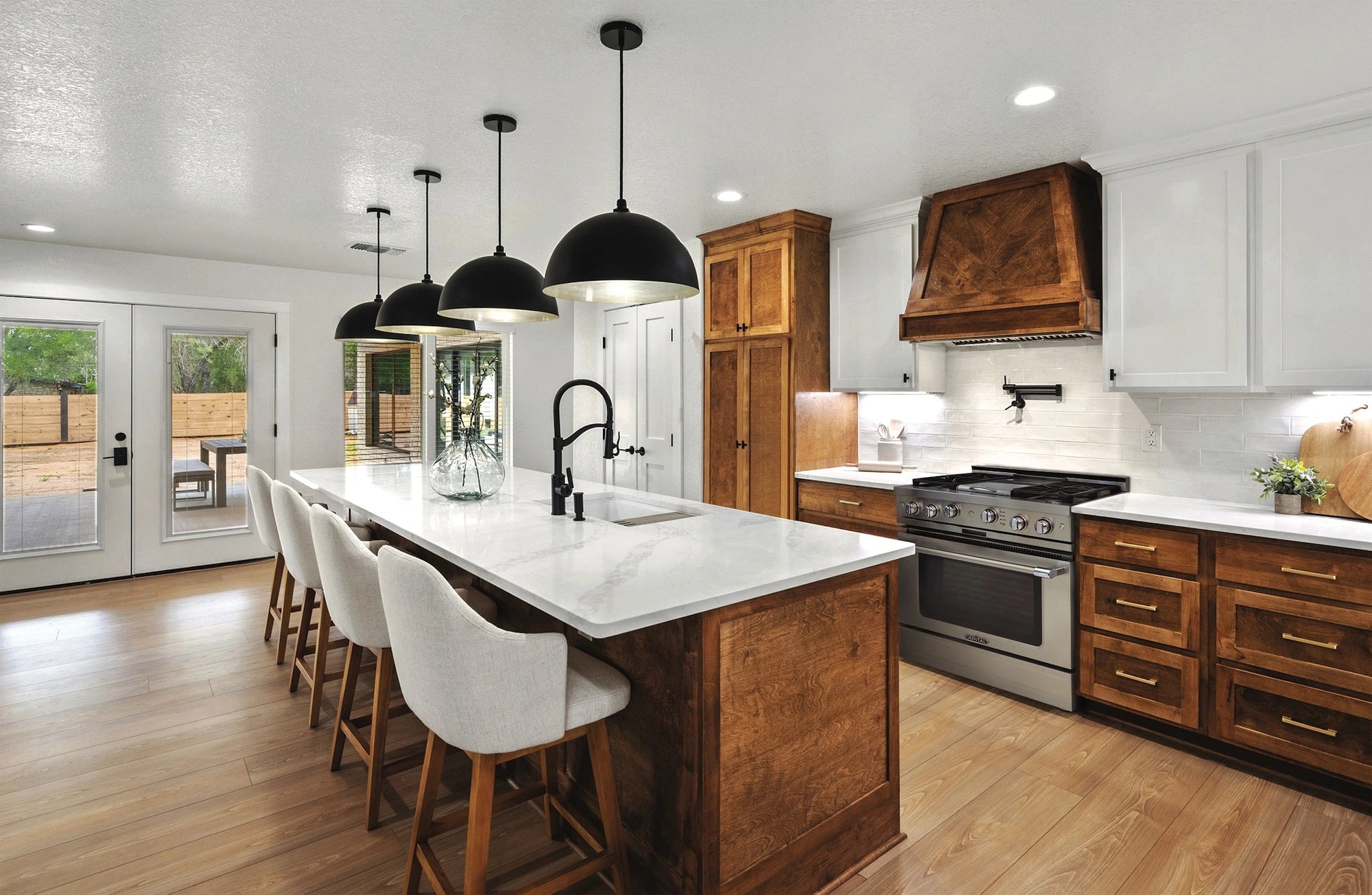 Stainless gas range with cooktop burners in a modern kitchen