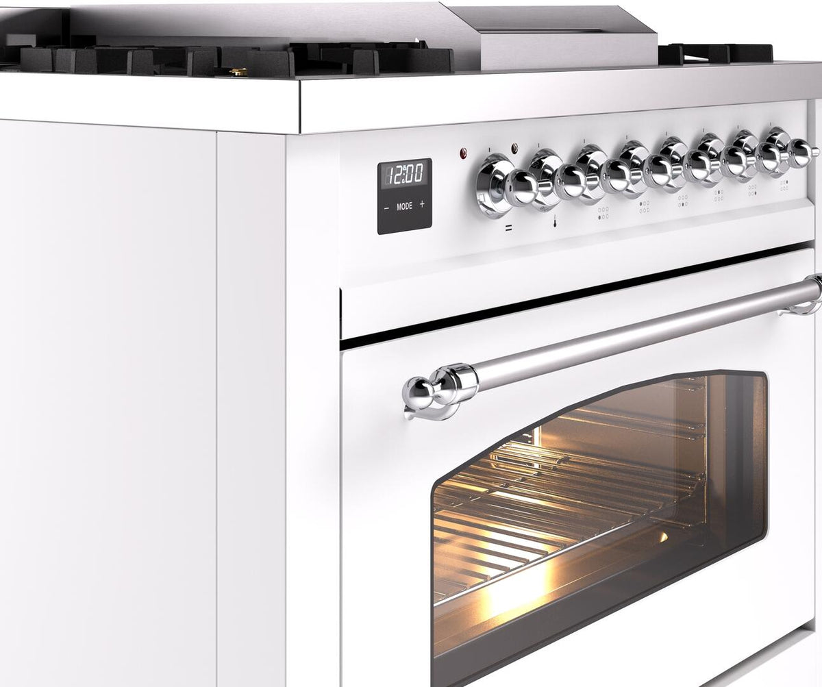 Chrome burner knobs and open oven door view on a white freestanding range
