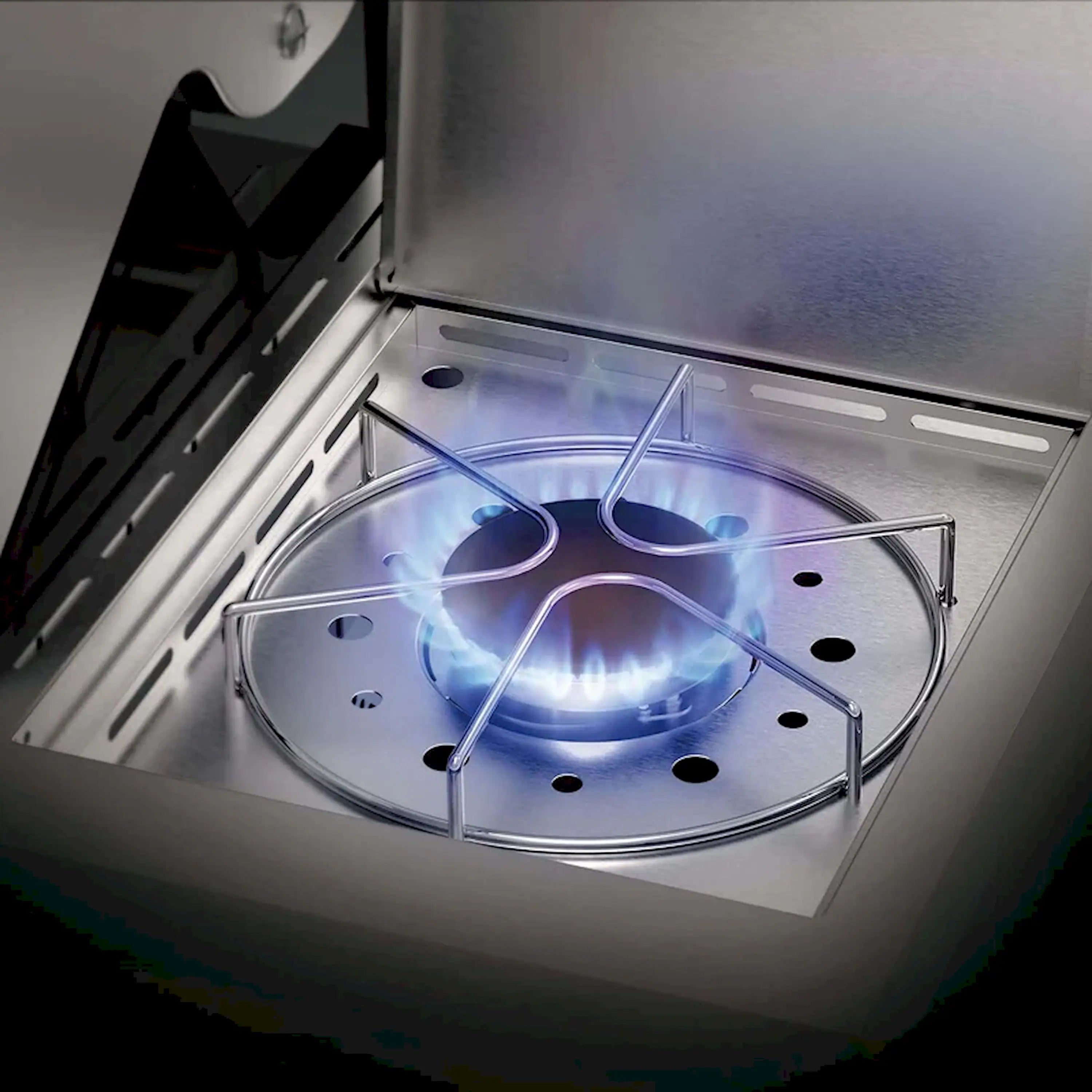 Open stainless steel grill with circular burner grate and blue flame