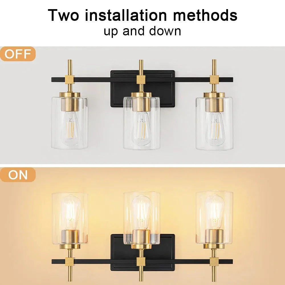 3-light bathroom vanity light with clear glass shades, black metal frame, gold accents