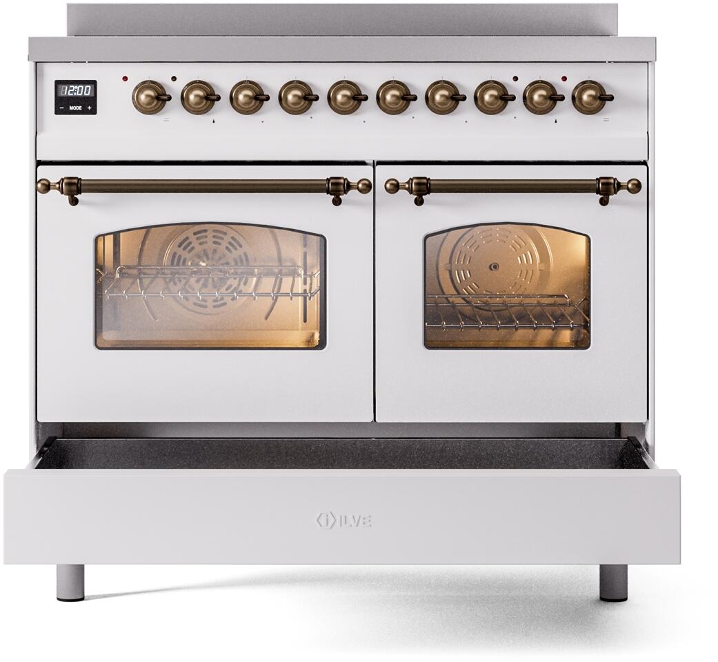 White induction range with front warming drawer open and bronze control knobs