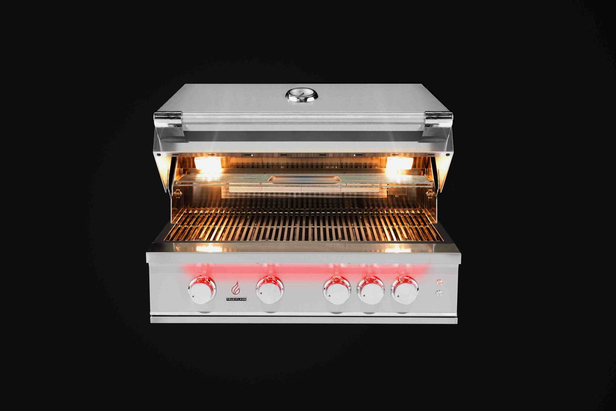 Built-in propane gas grill with open lid showing glowing burner grates and control knobs