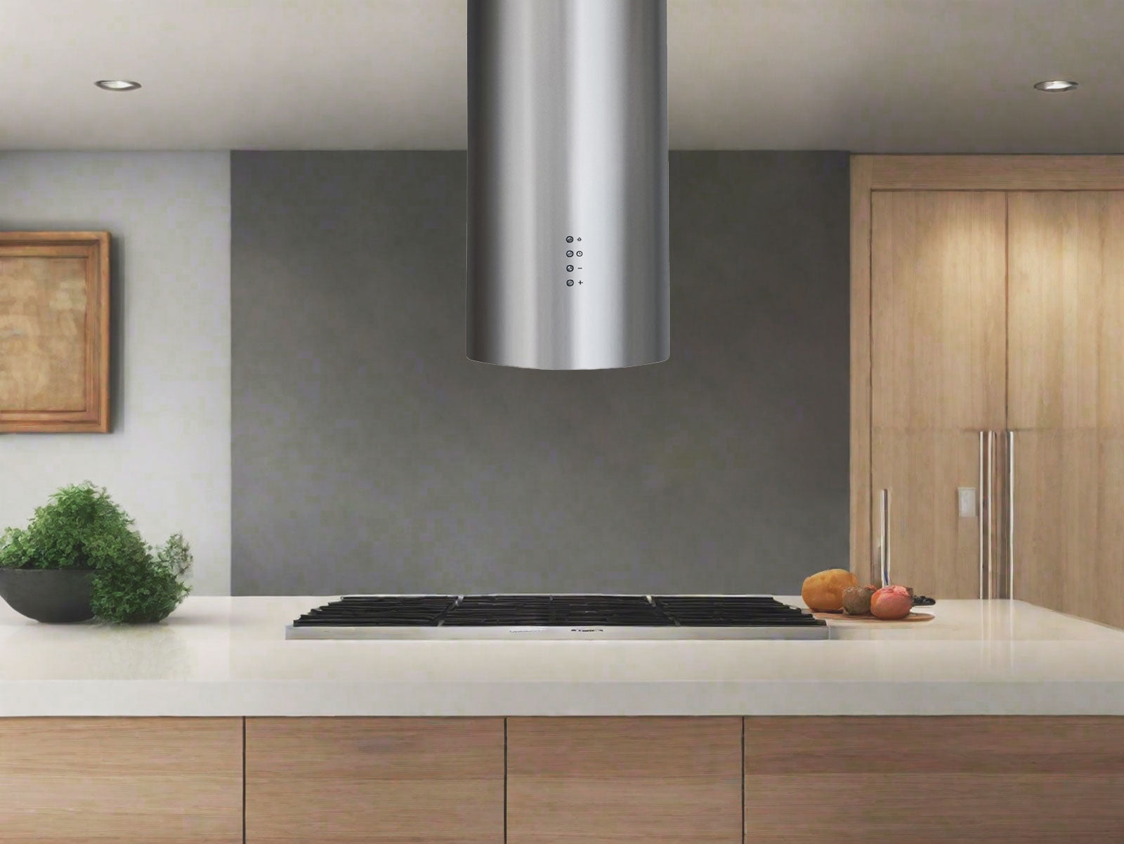 Stainless steel round cylinder island range hood above cooktop