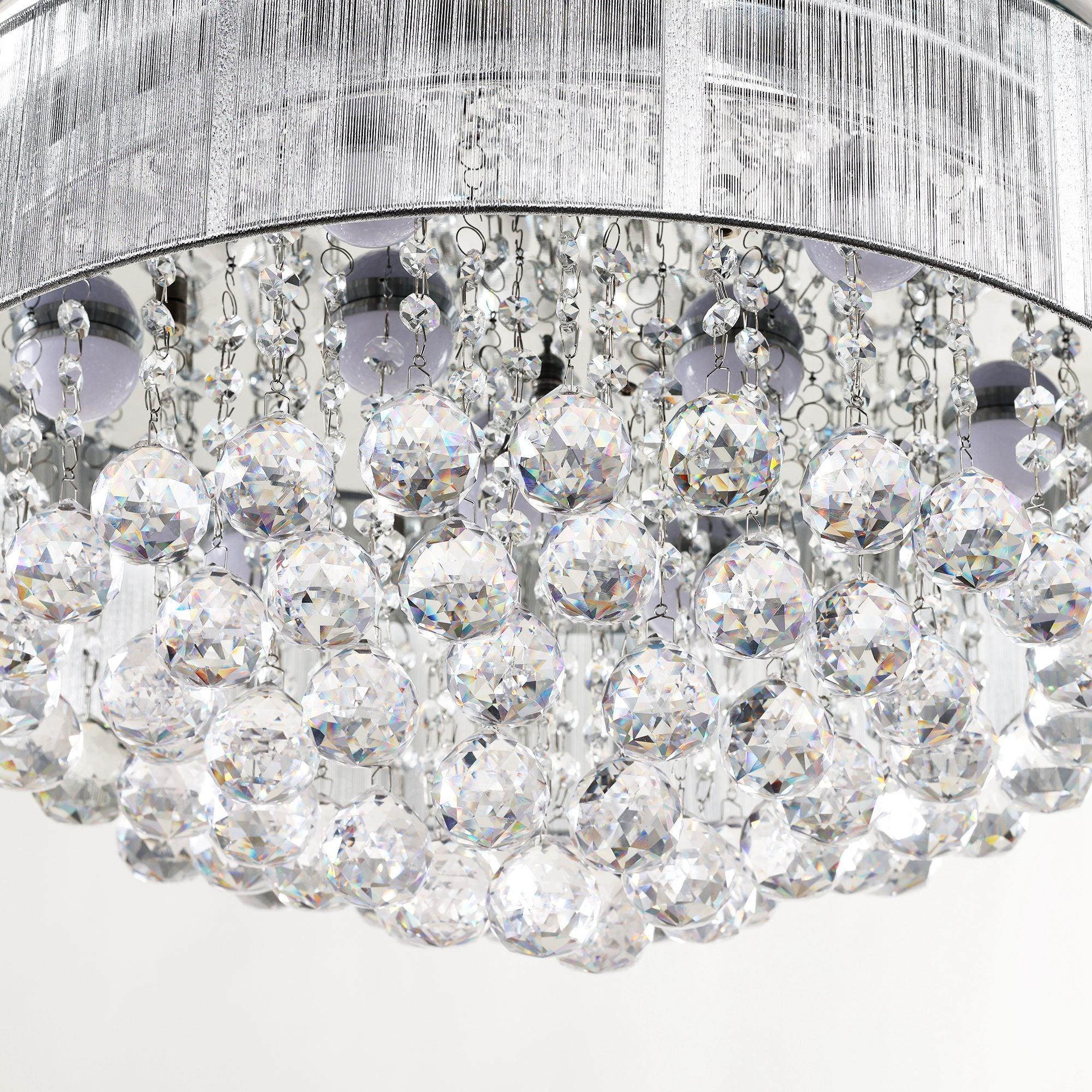 Crystal-style LED light cluster with dangling clear pieces beneath a chrome fan ring