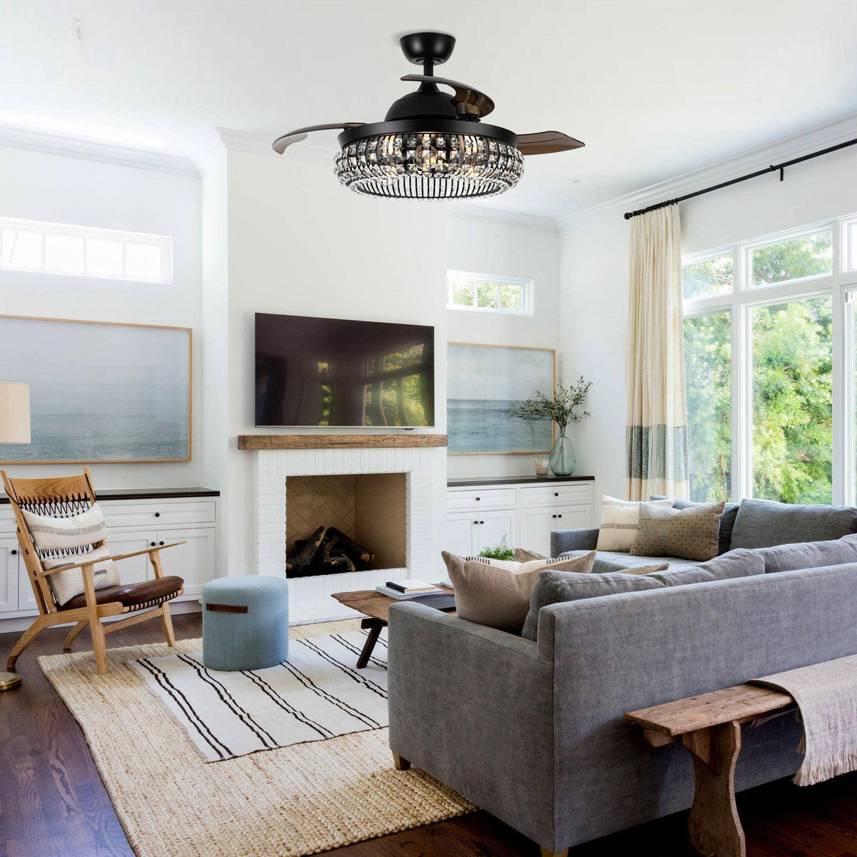 Black crystal ceiling fan with light fixture, shown centered in a living room