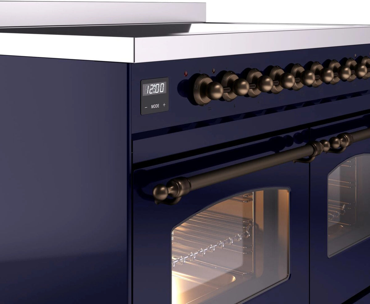Midnight blue control panel and bronze knob handles on an electric induction range