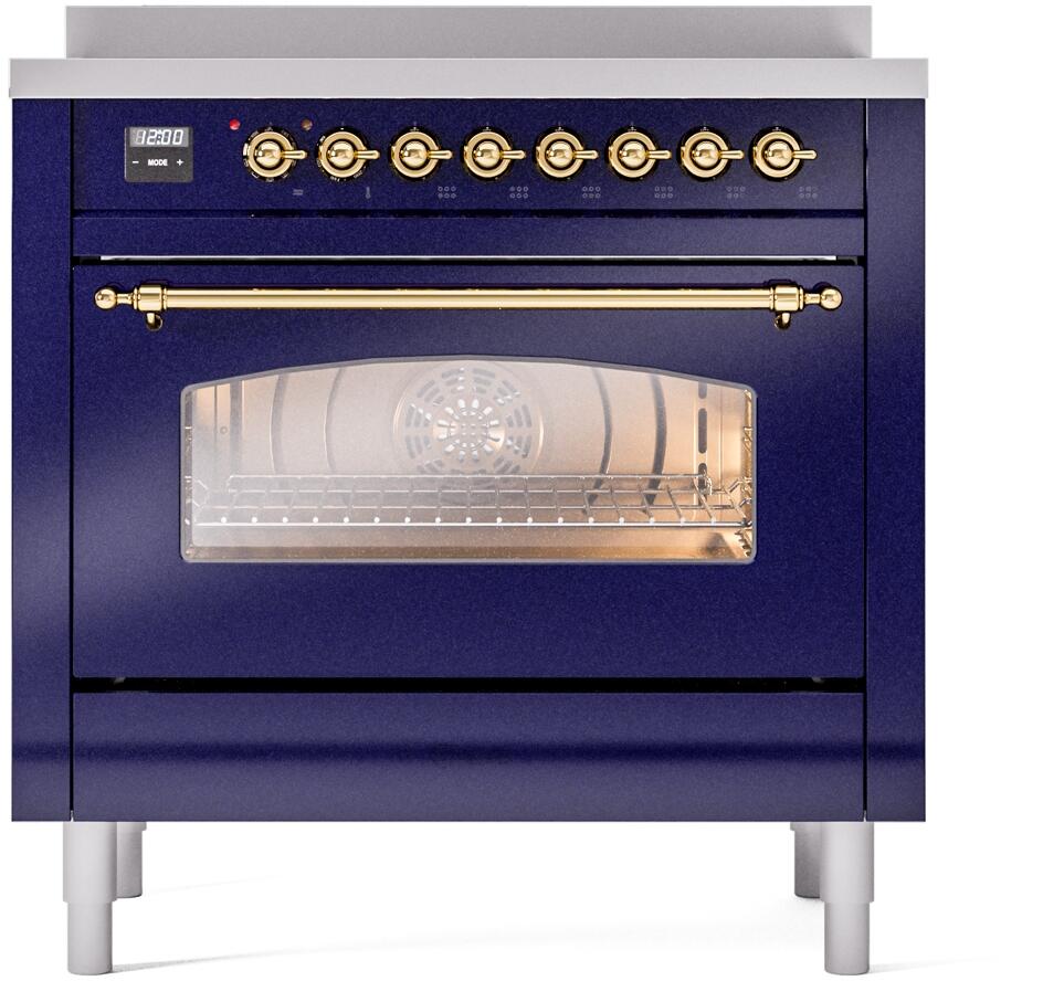 Midnight blue freestanding electric induction range with brass control knobs and oven window