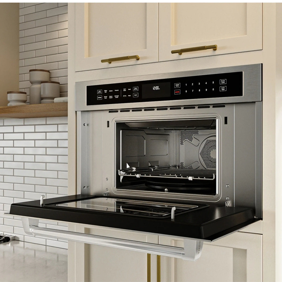Built-in stainless microwave oven with open drop-down door showing air fry basket and tray.