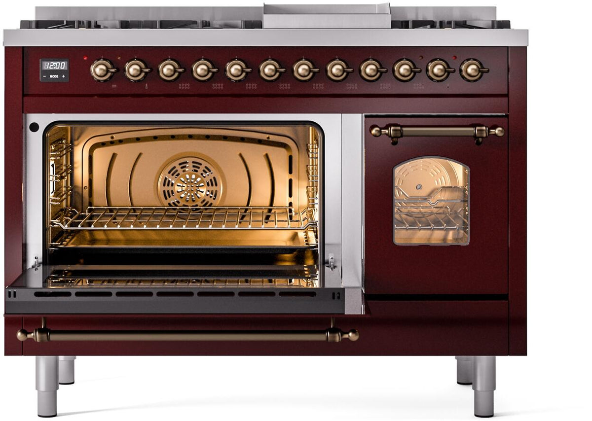 Freestanding range with both ovens open, showing warm-lit interior racks and fan