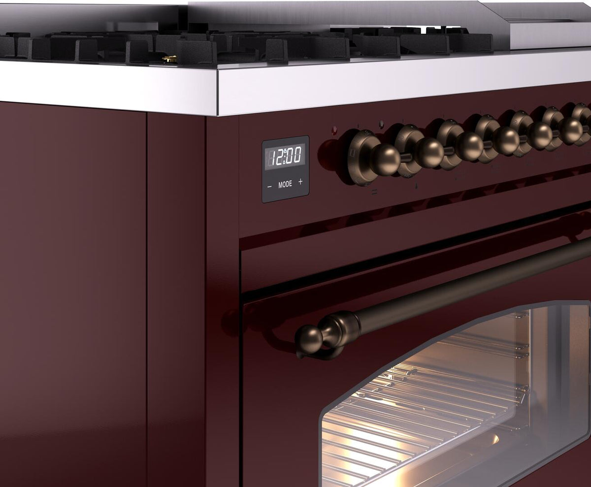 Burgundy dual-fuel freestanding range with bronze knob controls and oven handle