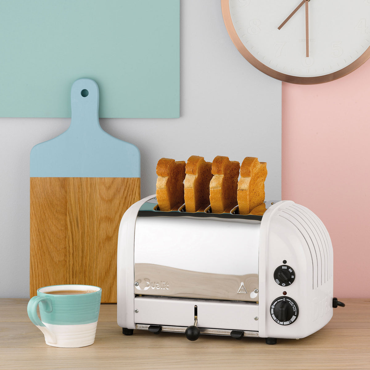 White 4-slice toaster with toast rising above the bread slots
