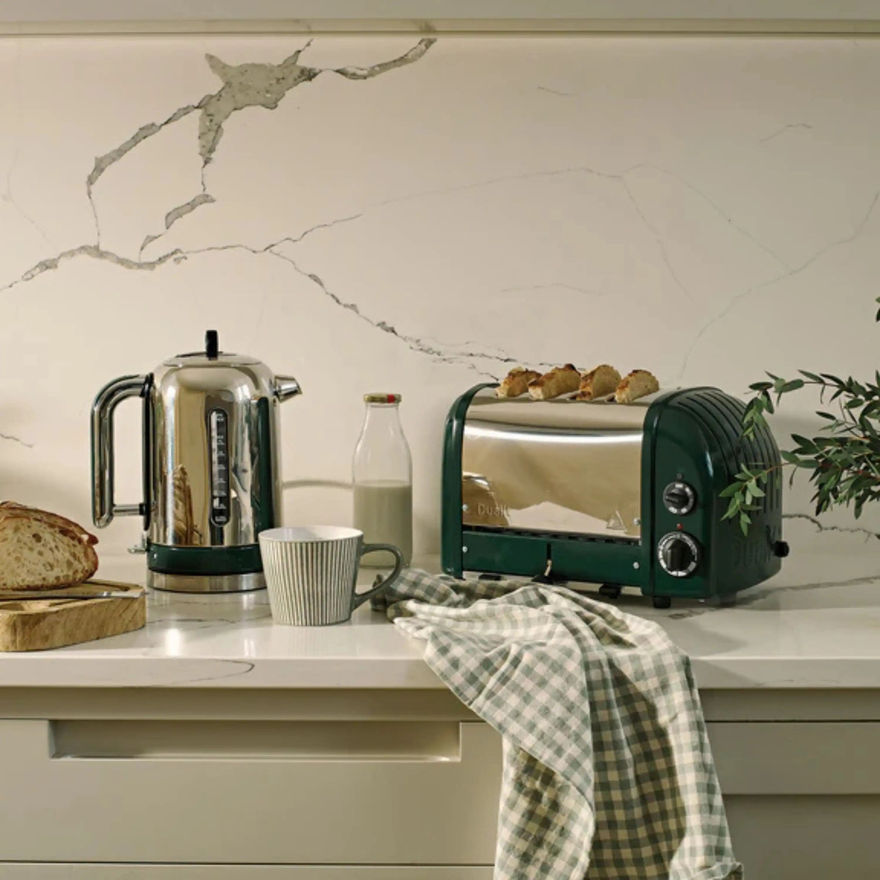 Evergreen Dualit 4-slice toaster on kitchen counter, front slots visible.