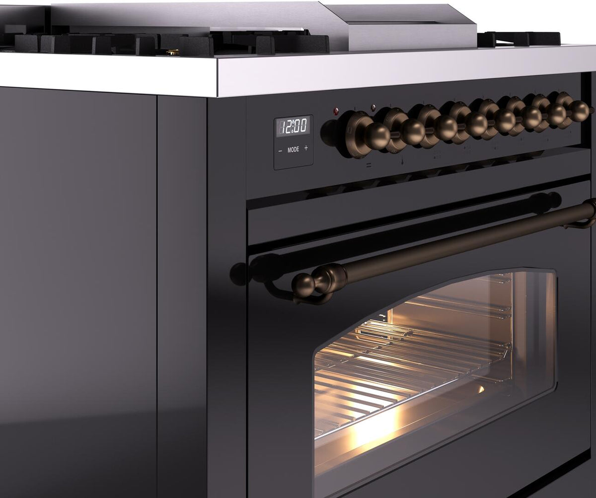 Freestanding range side view with bronze knobs and glass door revealing lit oven interior
