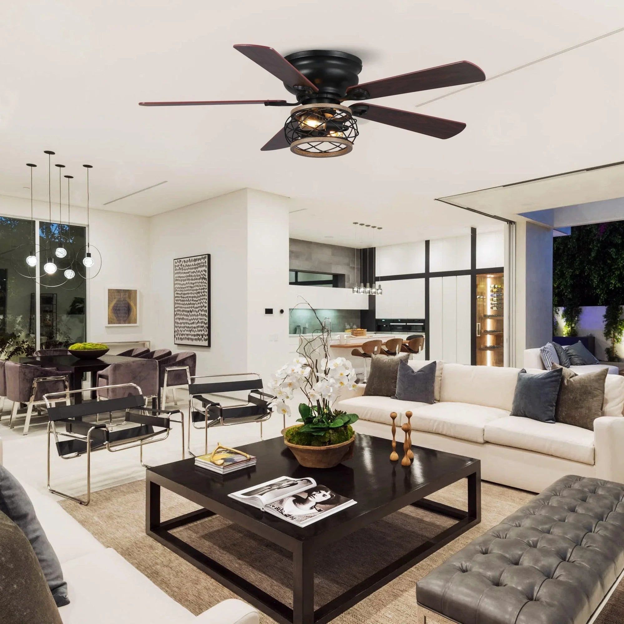 Black flush-mount ceiling fan with four wood blades and caged light fixture in living room