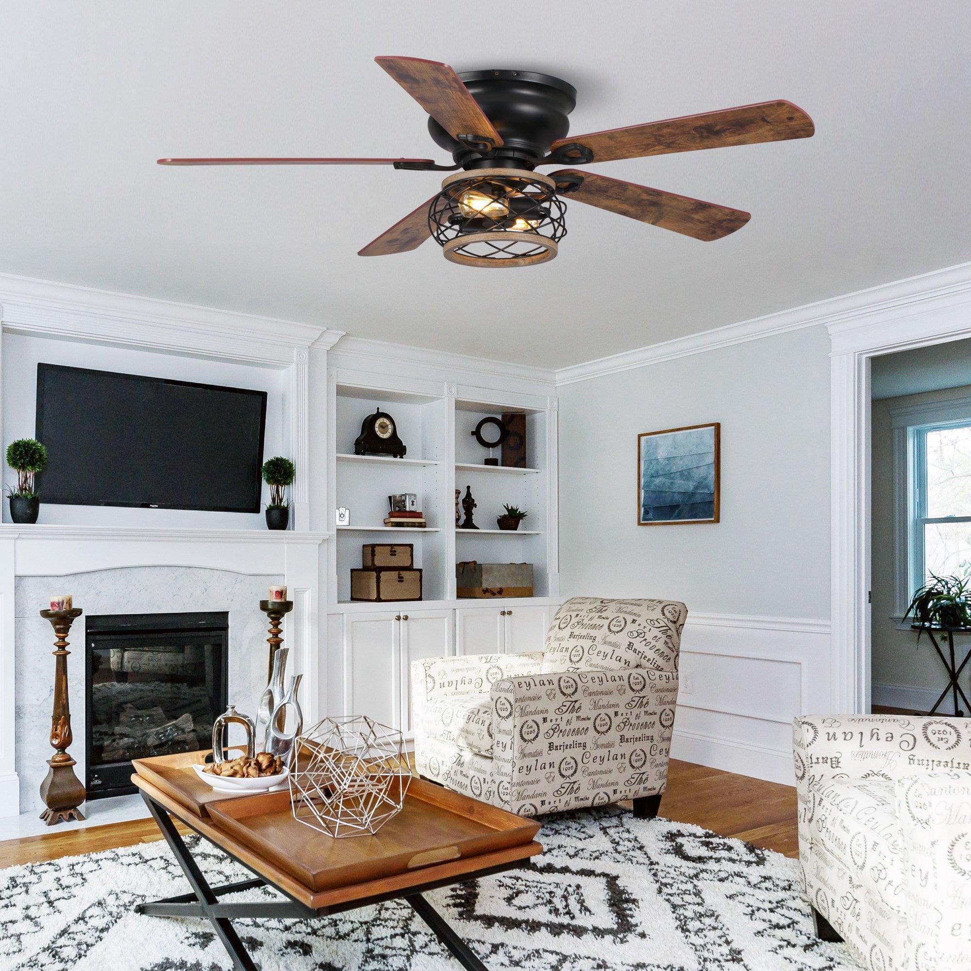 Black ceiling fan with dark wood blades and caged lighting fixture in a living room