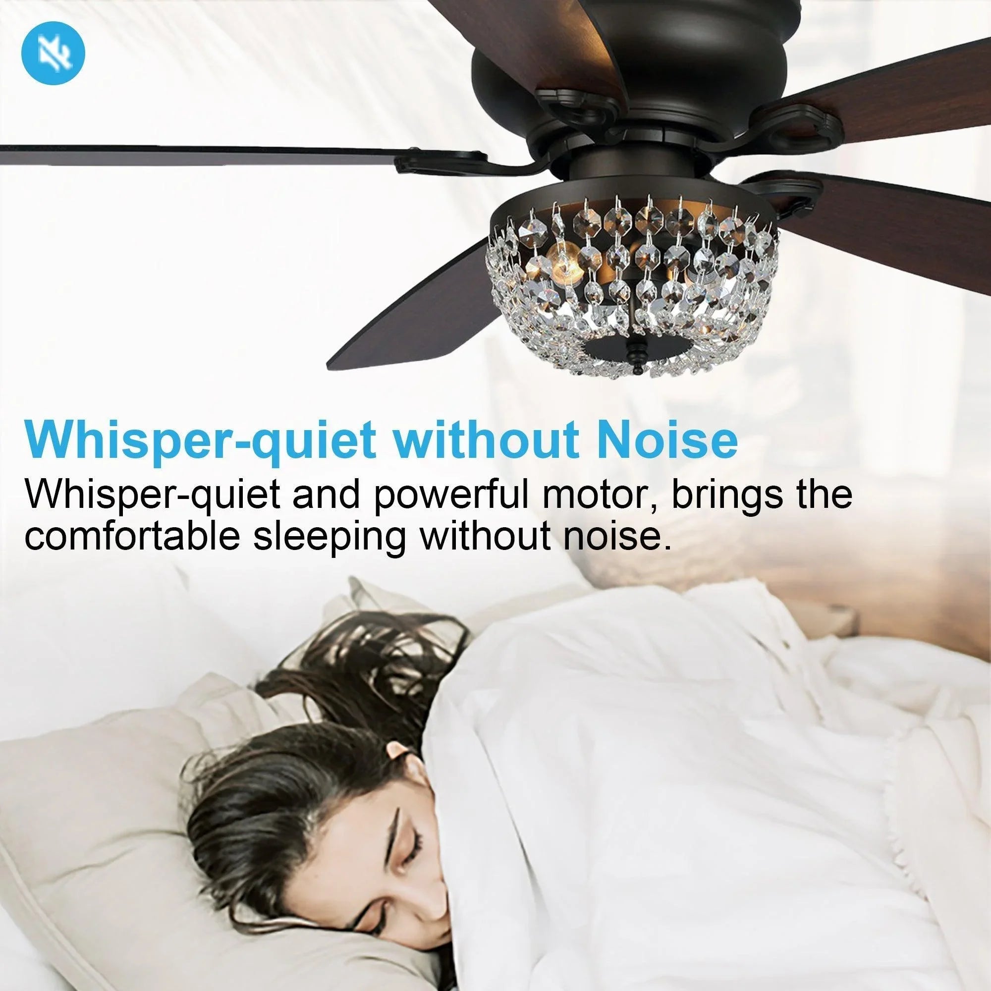 Ceiling fan with crystal light and dark wood blades centered over a bed